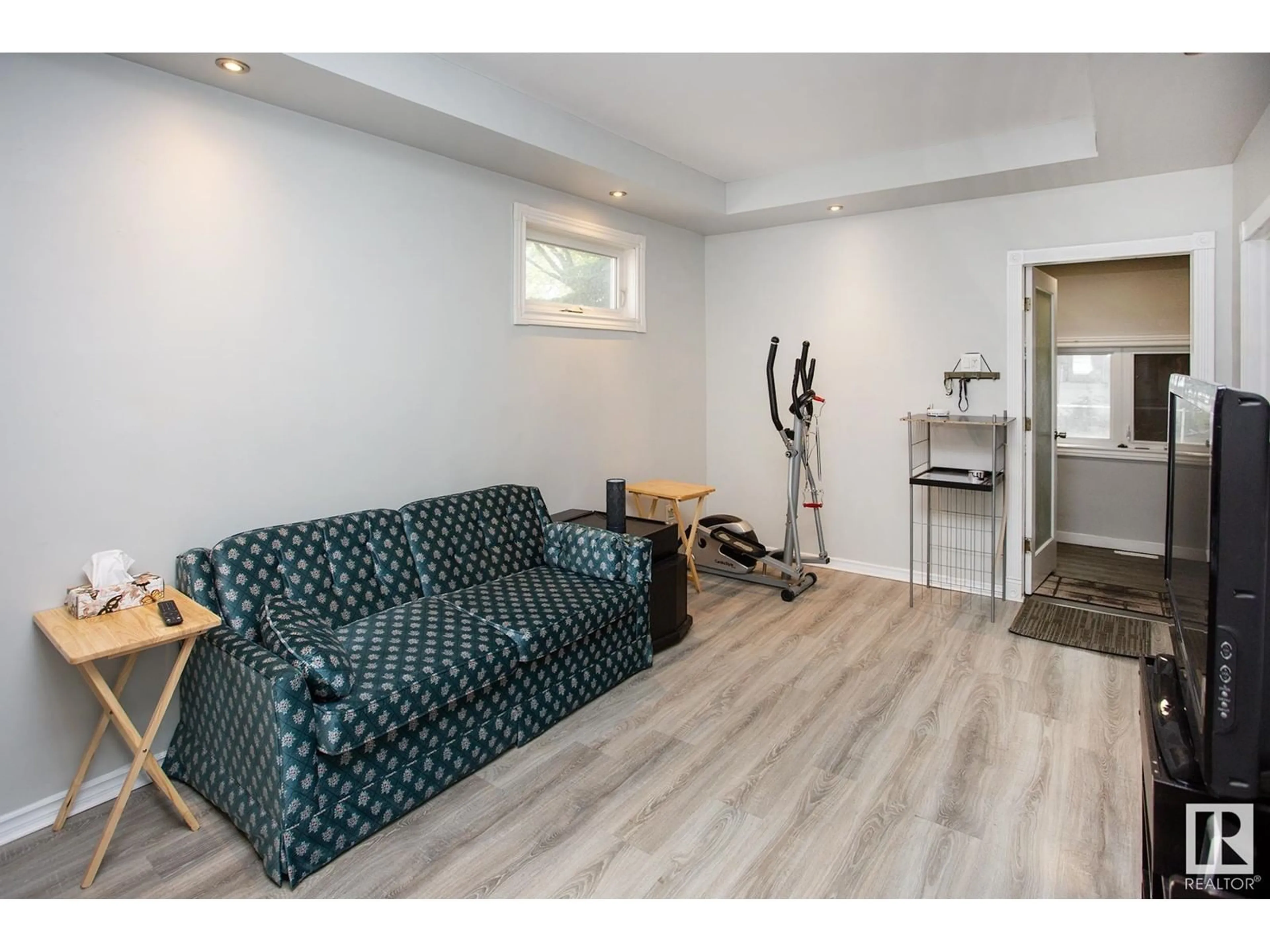 Living room with furniture, wood/laminate floor for 11536 83 ST, Edmonton Alberta T5B2Y5