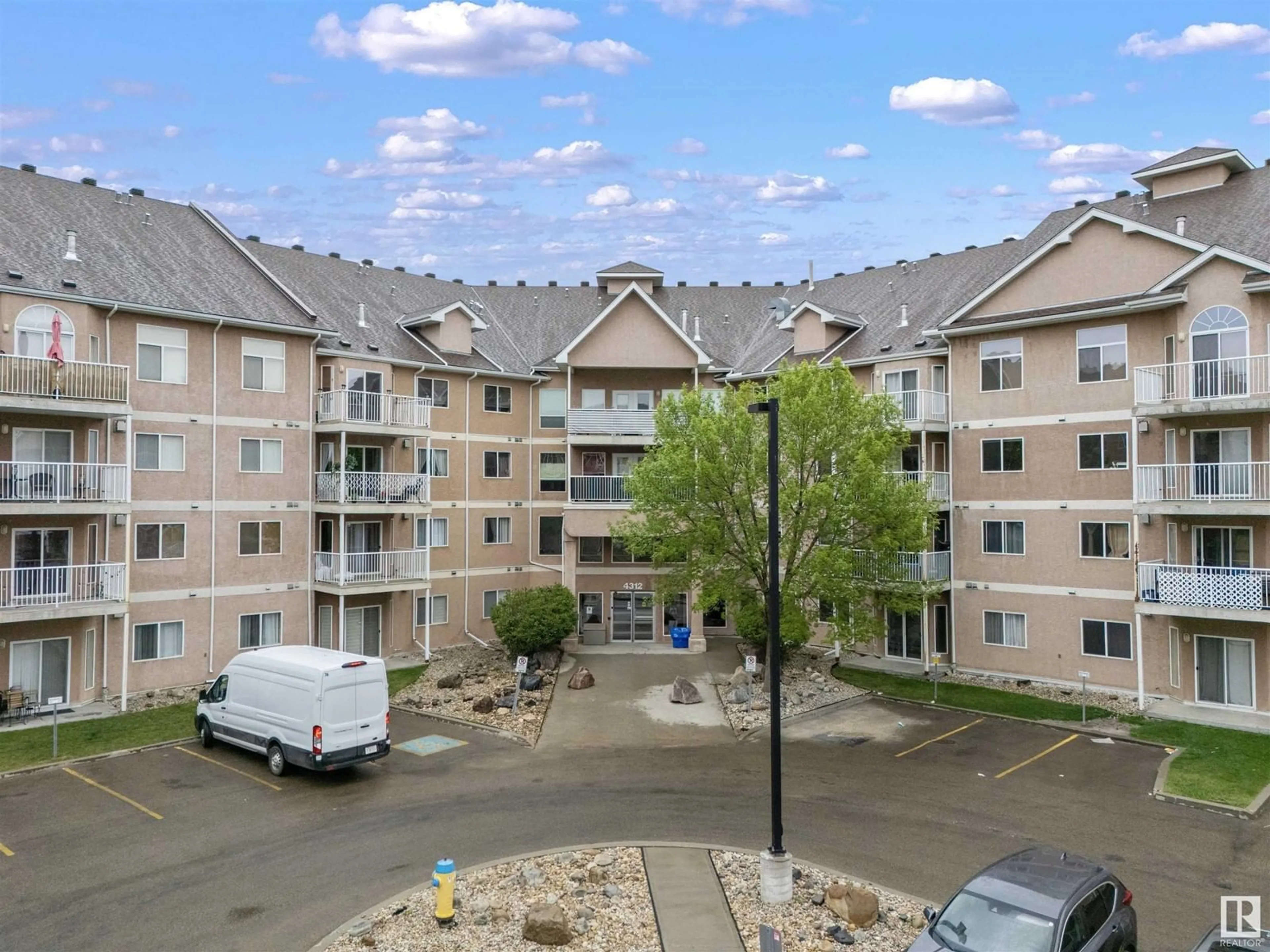 A pic from outside/outdoor area/front of a property/back of a property/a pic from drone, mountain view for #310 - 4312 139 AV, Edmonton Alberta T5Y3J4
