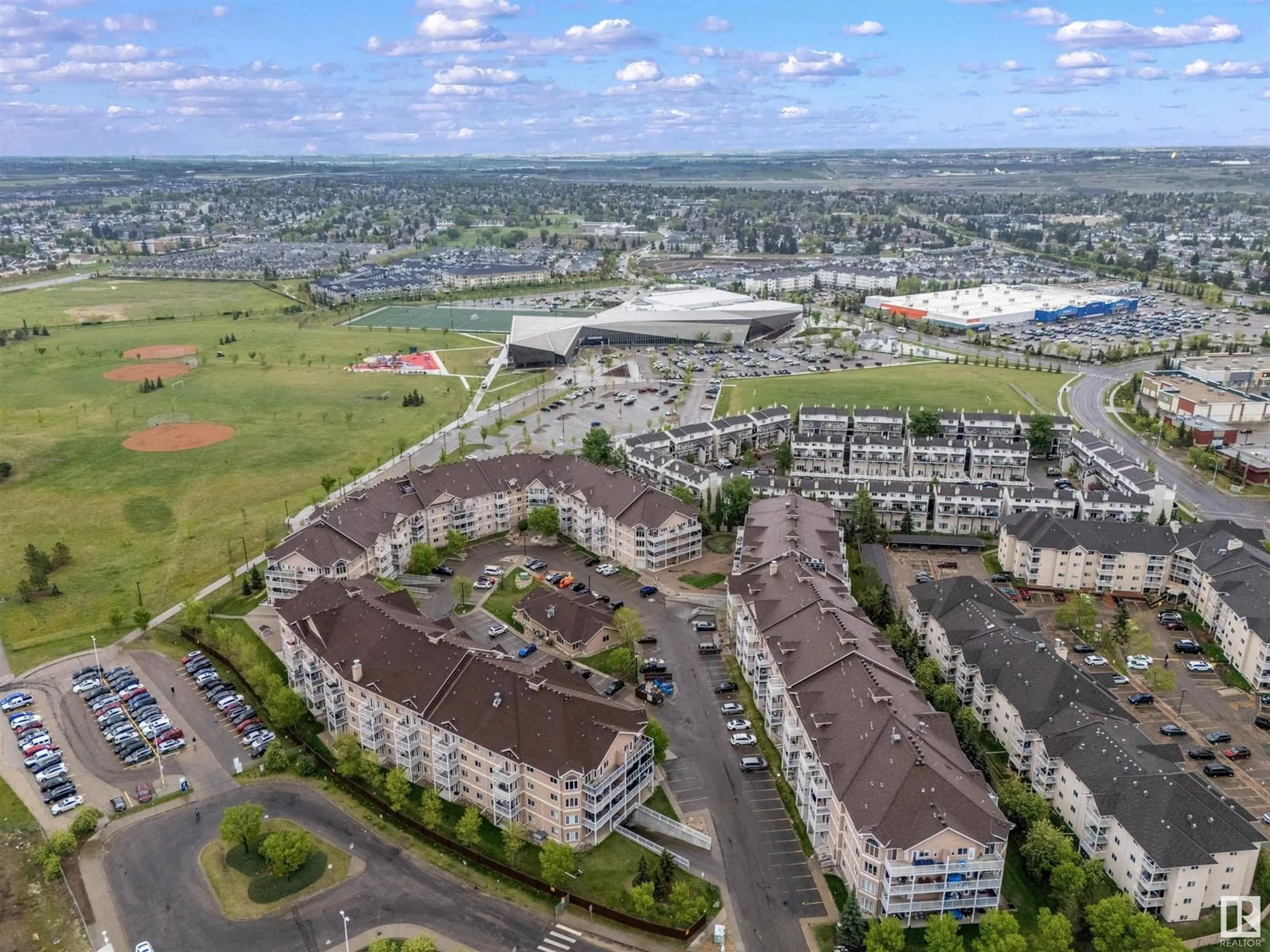 A pic from outside/outdoor area/front of a property/back of a property/a pic from drone, mountain view for #310 - 4312 139 AV, Edmonton Alberta T5Y3J4