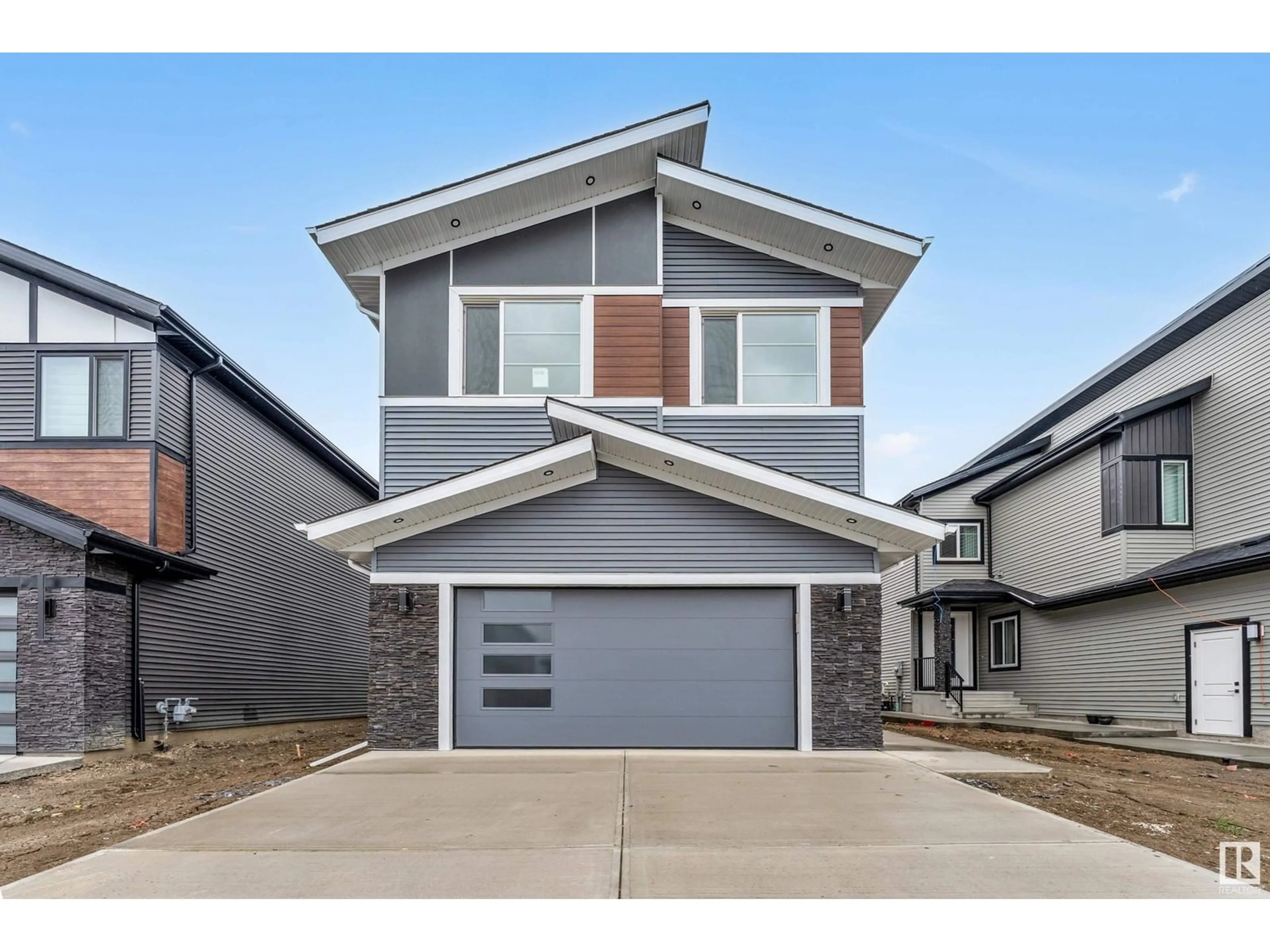 Home with vinyl exterior material, street for NE - 6238 19 ST, Rural Leduc County Alberta T4X3C8