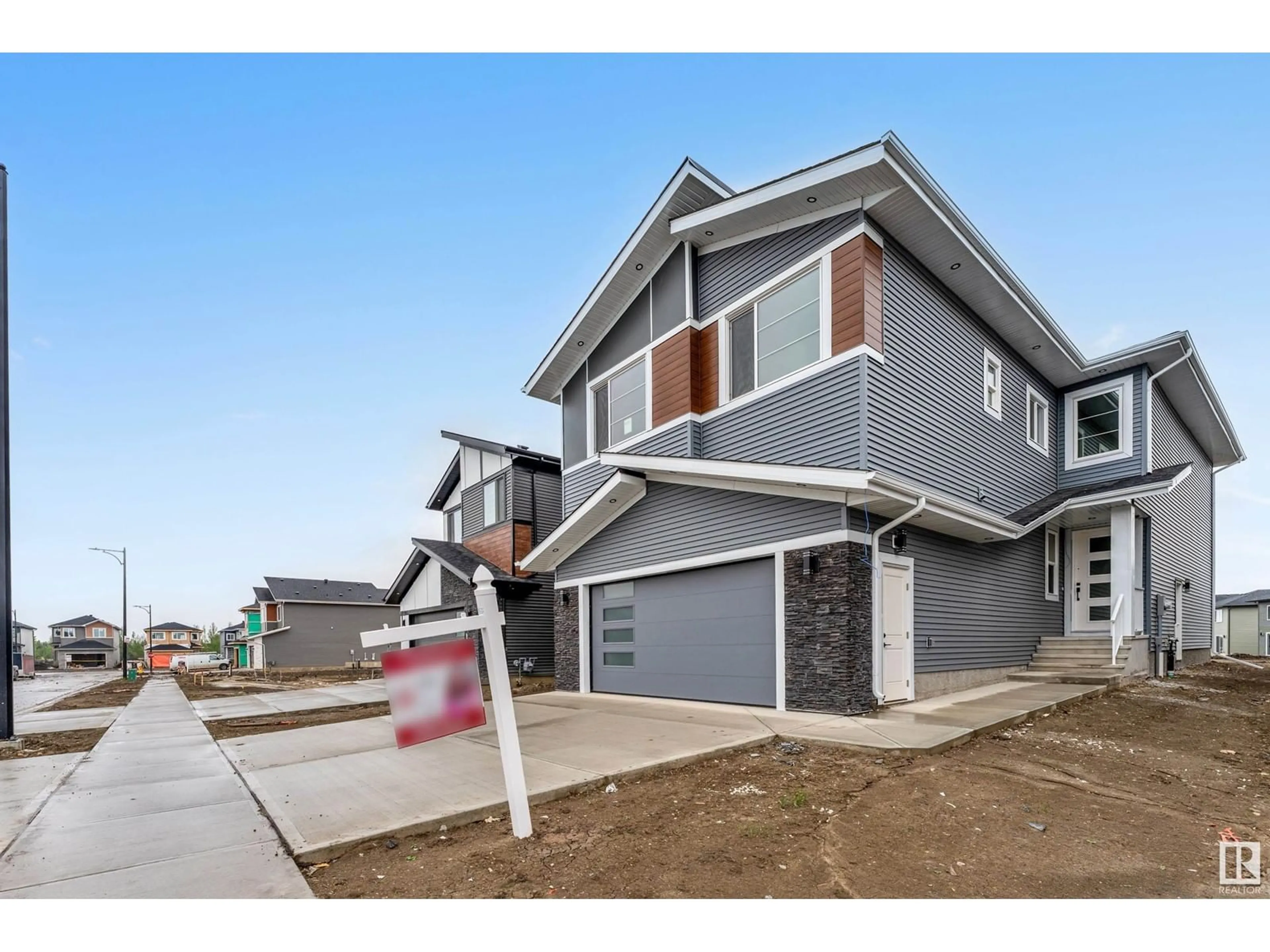 Home with vinyl exterior material, street for NE - 6238 19 ST, Rural Leduc County Alberta T4X3C8
