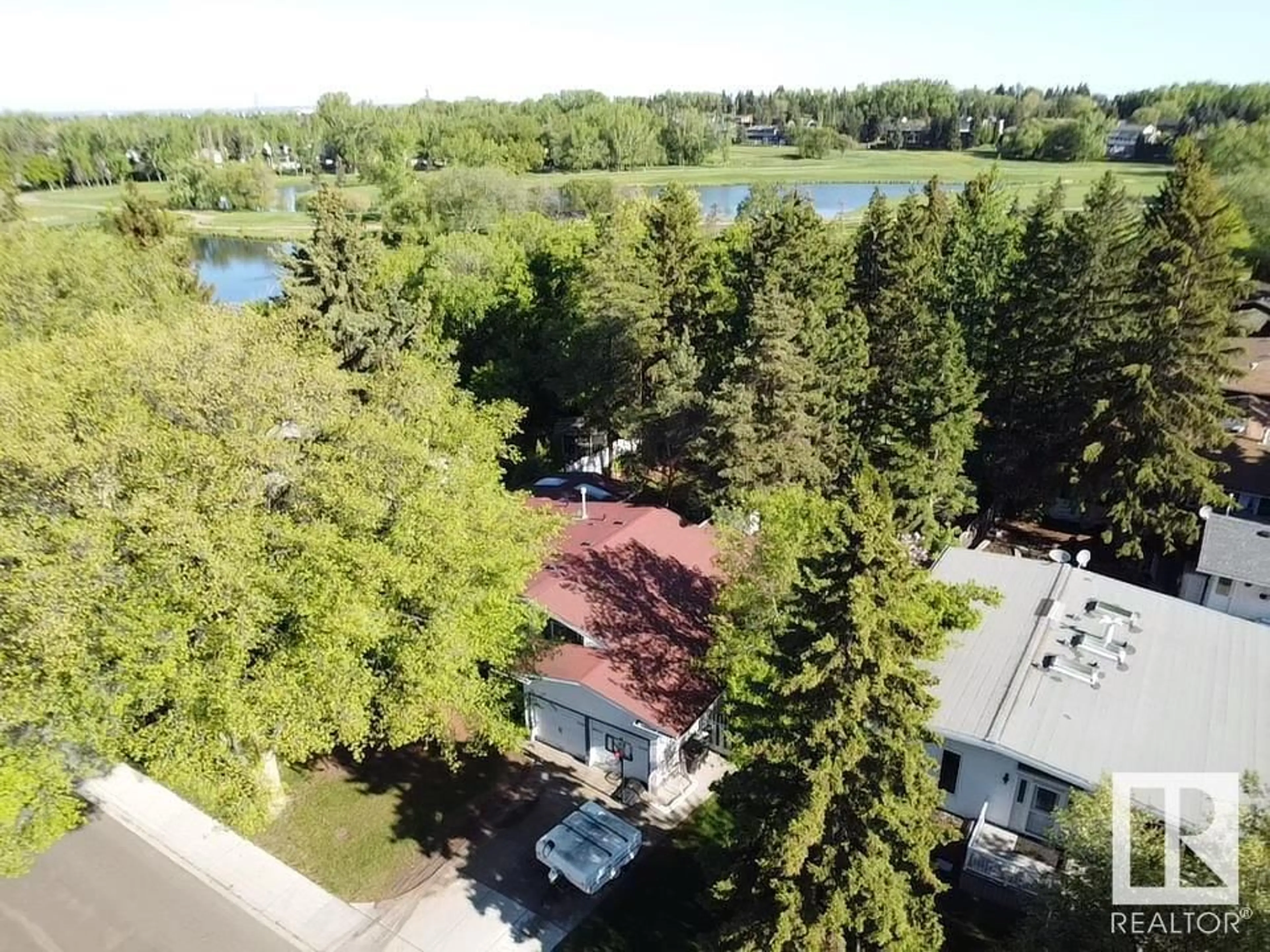 A pic from outside/outdoor area/front of a property/back of a property/a pic from drone, water/lake/river/ocean view for 1990 GLENMORE AV, Sherwood Park Alberta T8A2G5