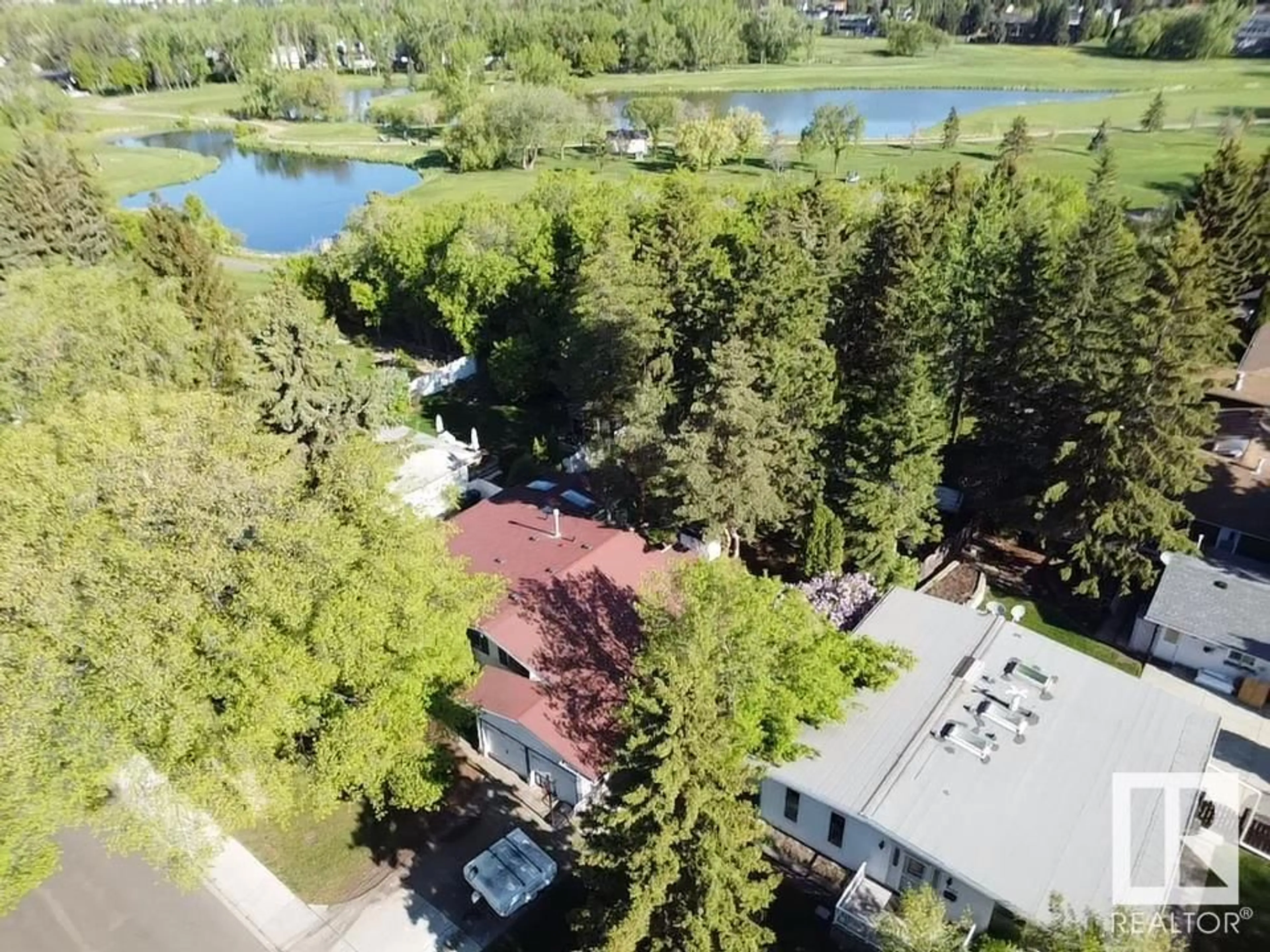 A pic from outside/outdoor area/front of a property/back of a property/a pic from drone, water/lake/river/ocean view for 1990 GLENMORE AV, Sherwood Park Alberta T8A2G5