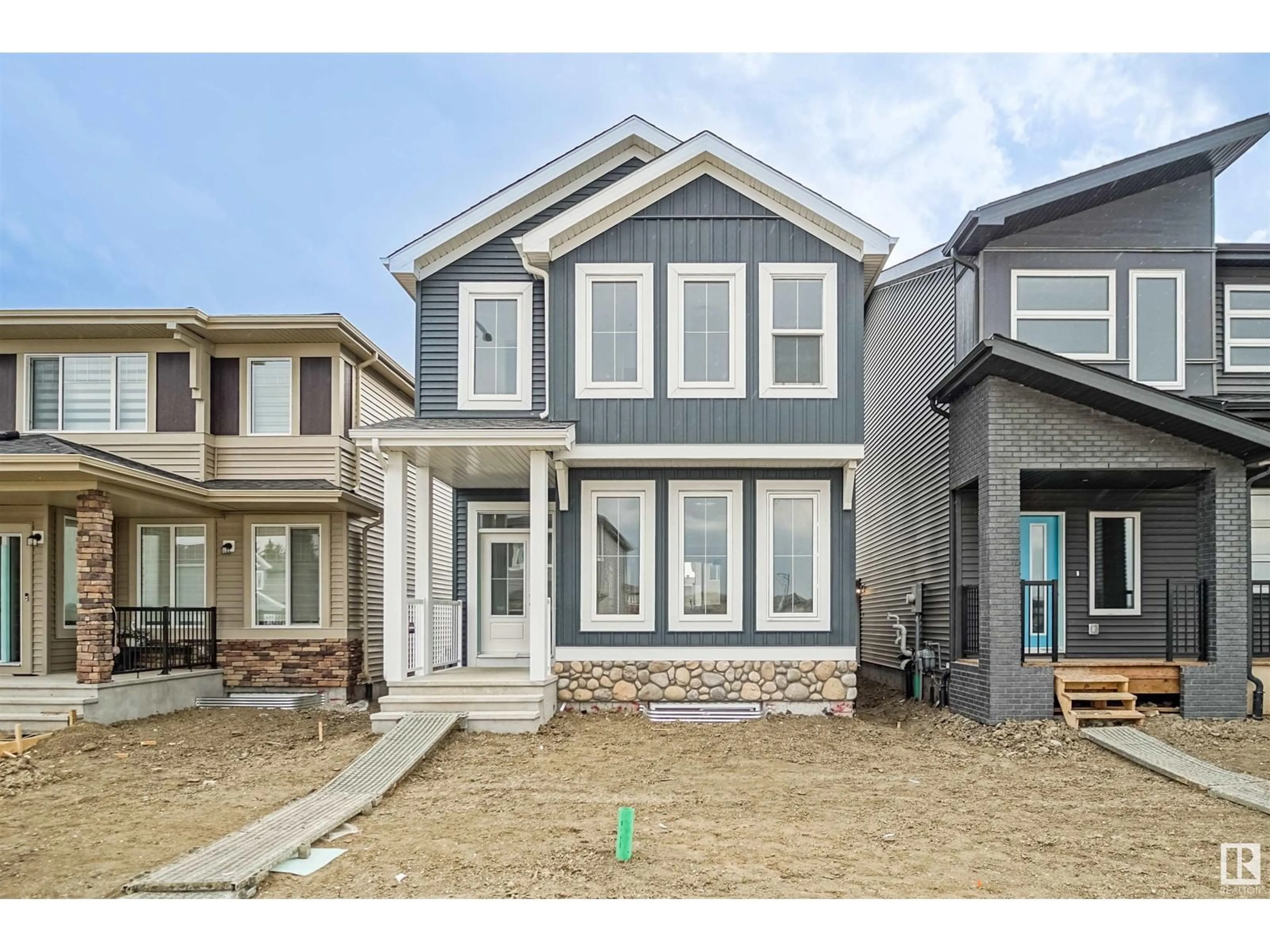 Home with vinyl exterior material, street for NW - 4615 177 AV, Edmonton Alberta T5Y4B7