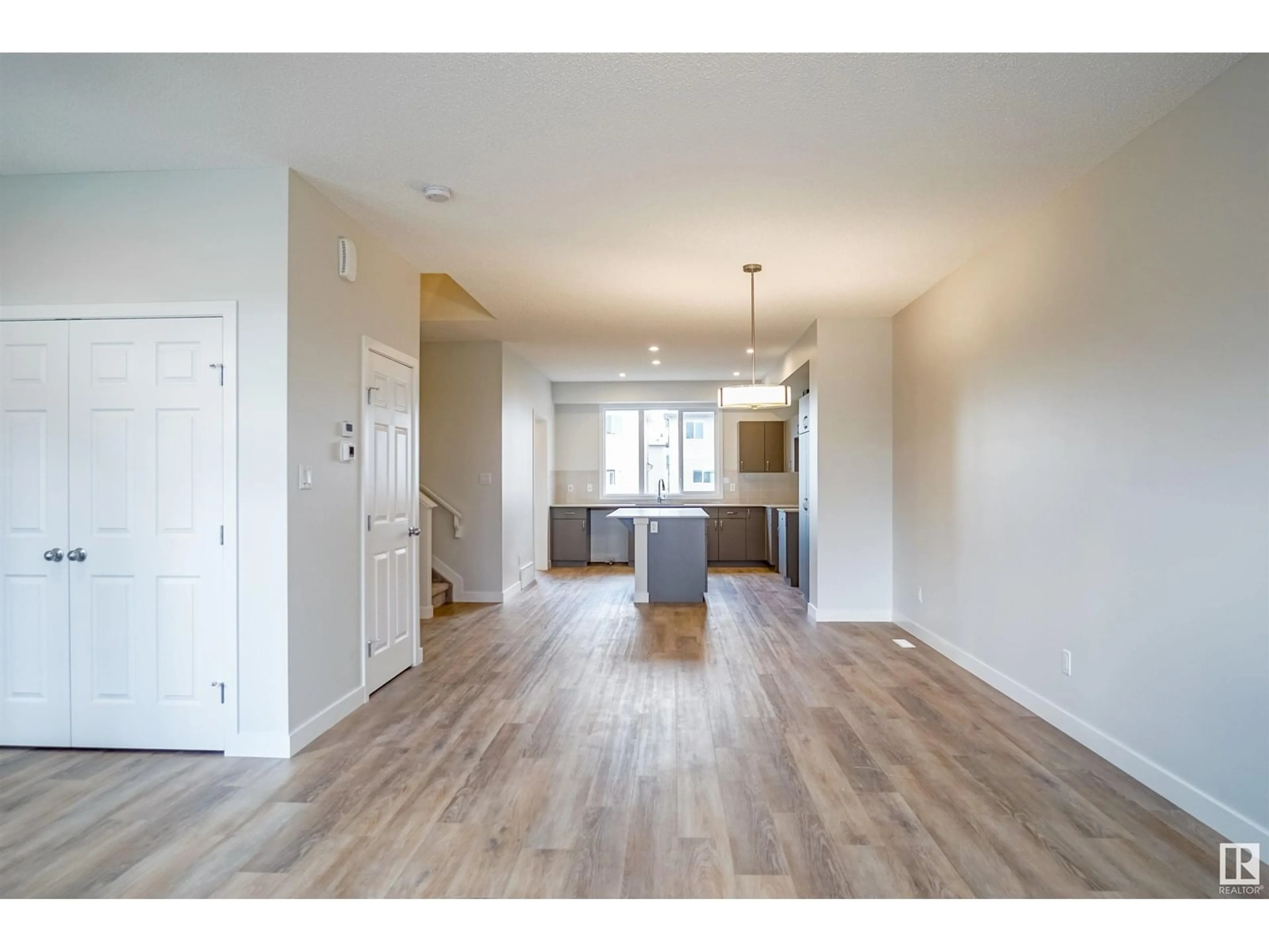 Open concept kitchen, wood/laminate floor for NW - 4615 177 AV, Edmonton Alberta T5Y4B7