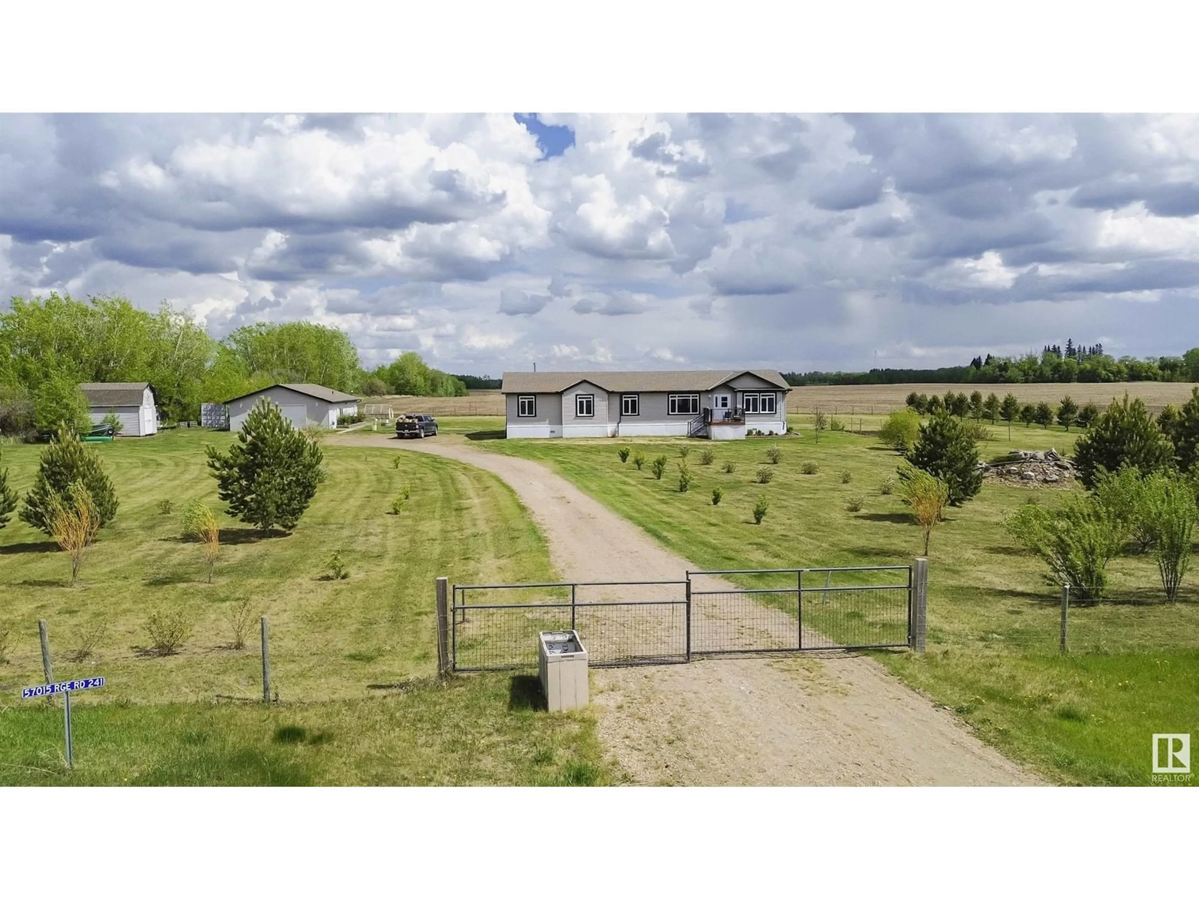 A pic from outside/outdoor area/front of a property/back of a property/a pic from drone, street for 57015 RR 241, Rural Sturgeon County Alberta T0A0K1