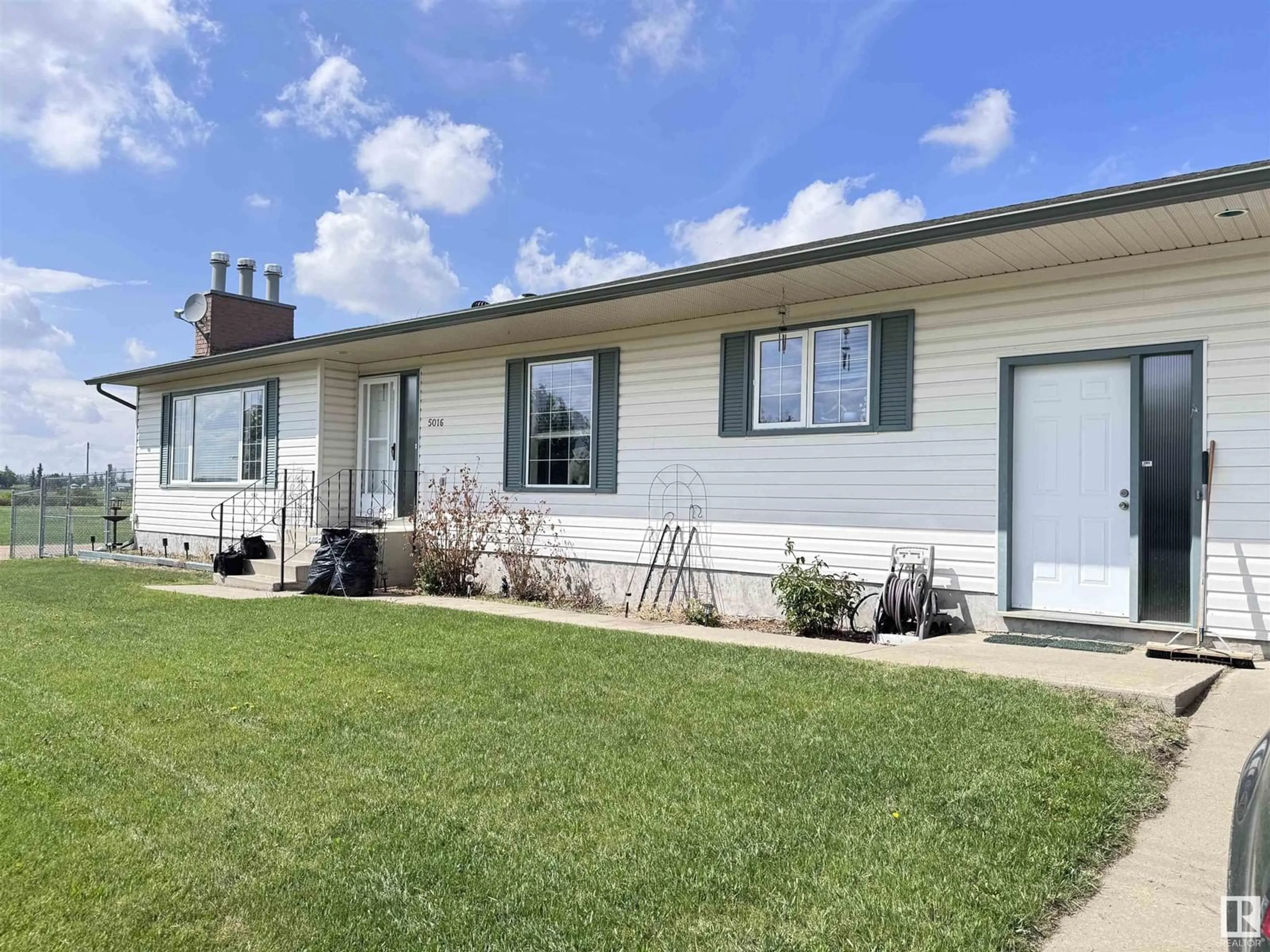 Home with vinyl exterior material, street for 5016 47 AV, Clyde Alberta T0G2P0