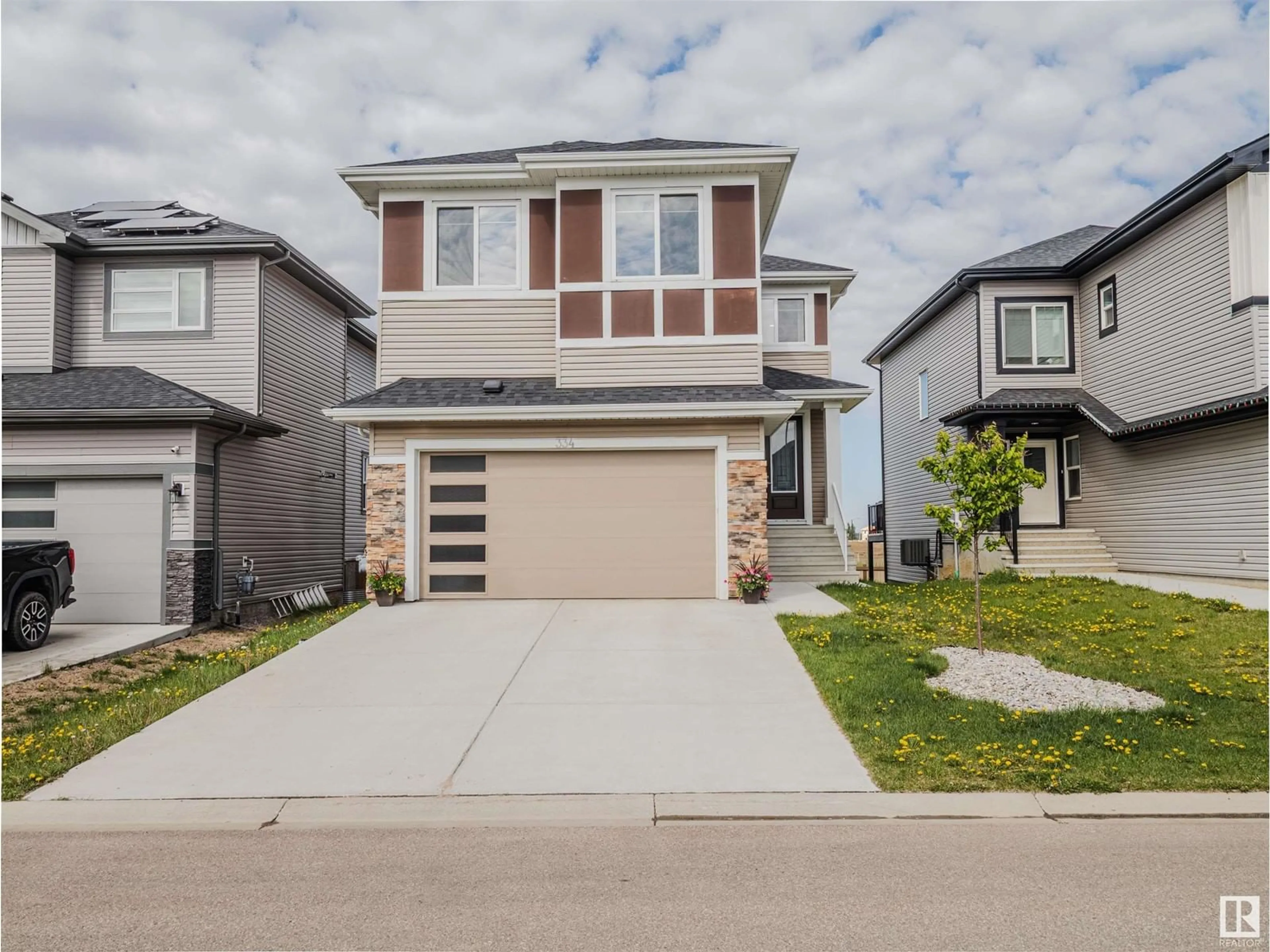 Home with vinyl exterior material, street for 334 ASTON CL, Leduc Alberta T9E1H9