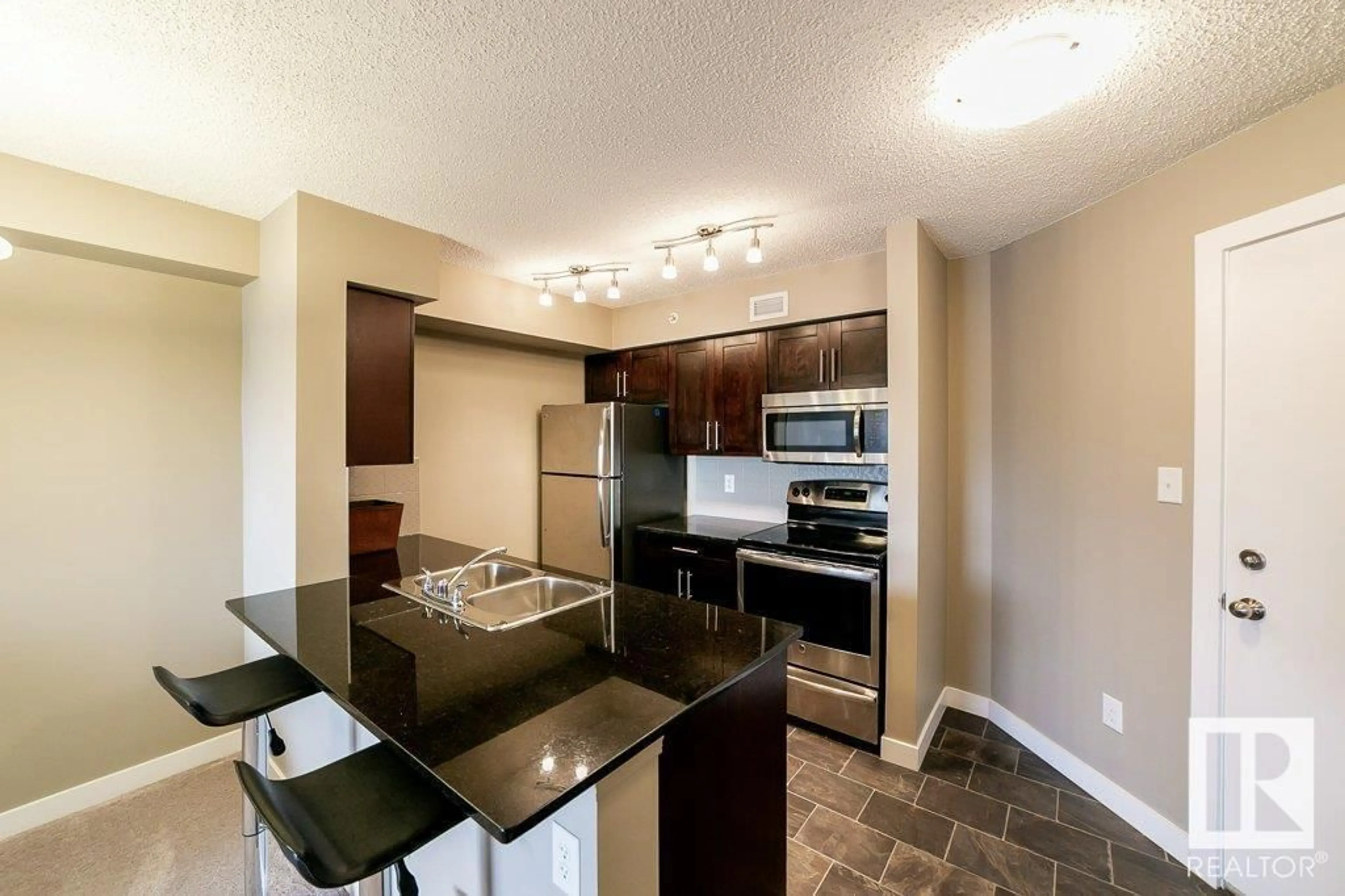 Open concept kitchen, unknown for #410 - 270 MCCONACHIE DR, Edmonton Alberta T5Y3N4