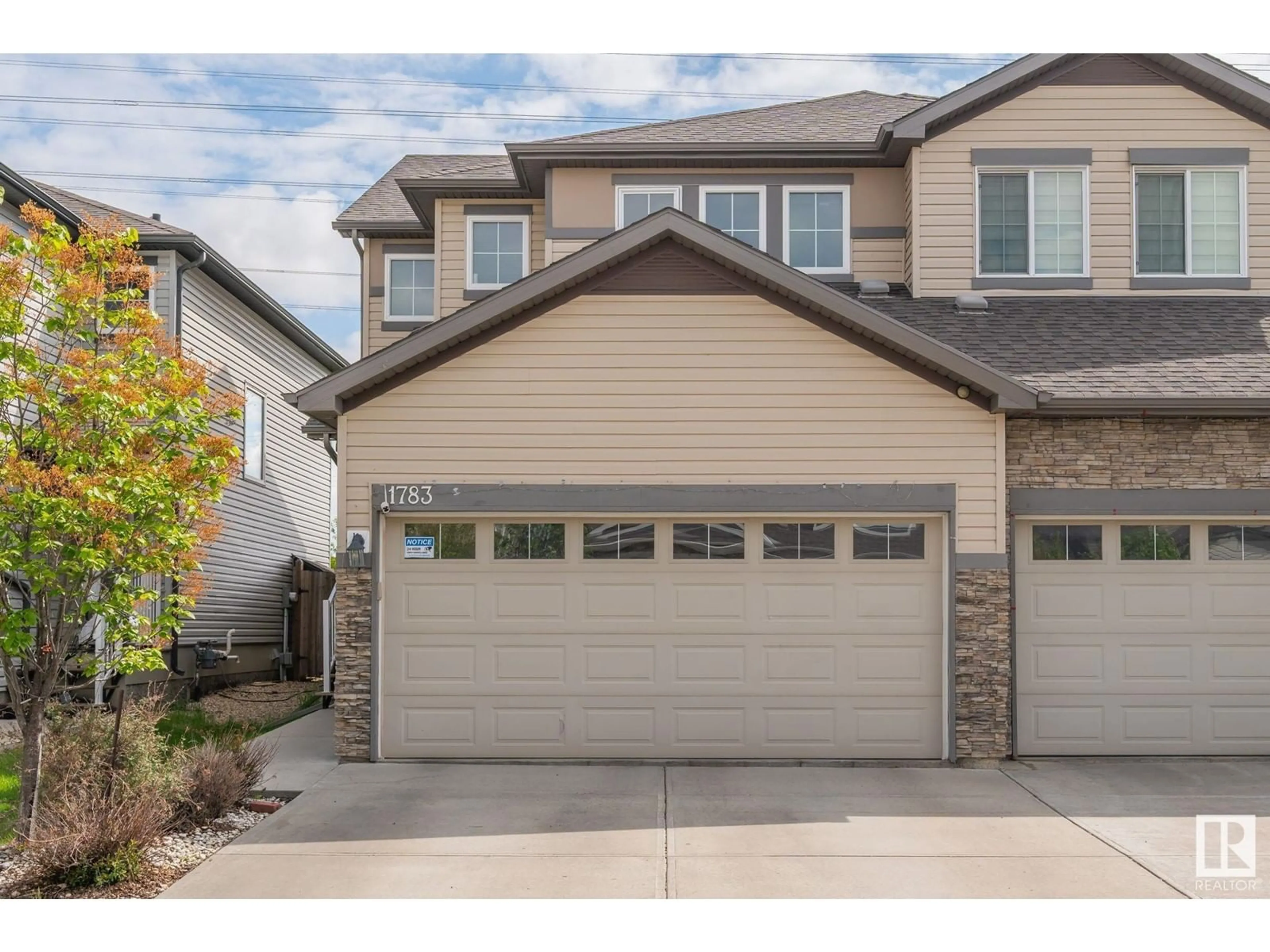 Home with vinyl exterior material, street for 1783 28 STREET, Edmonton Alberta T6T0S7