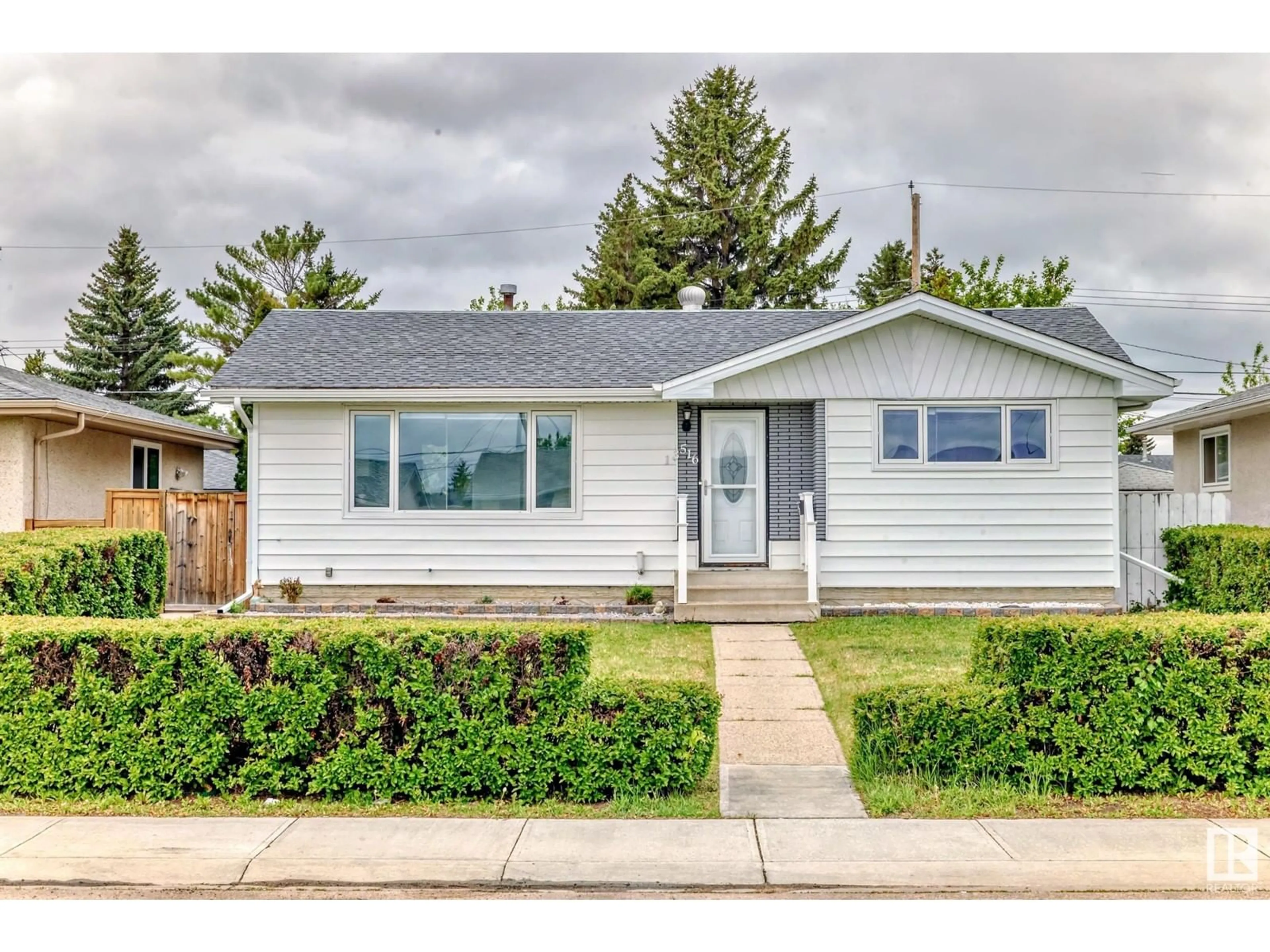 Home with vinyl exterior material, street for NW - 13516 112 ST, Edmonton Alberta T5E5A4