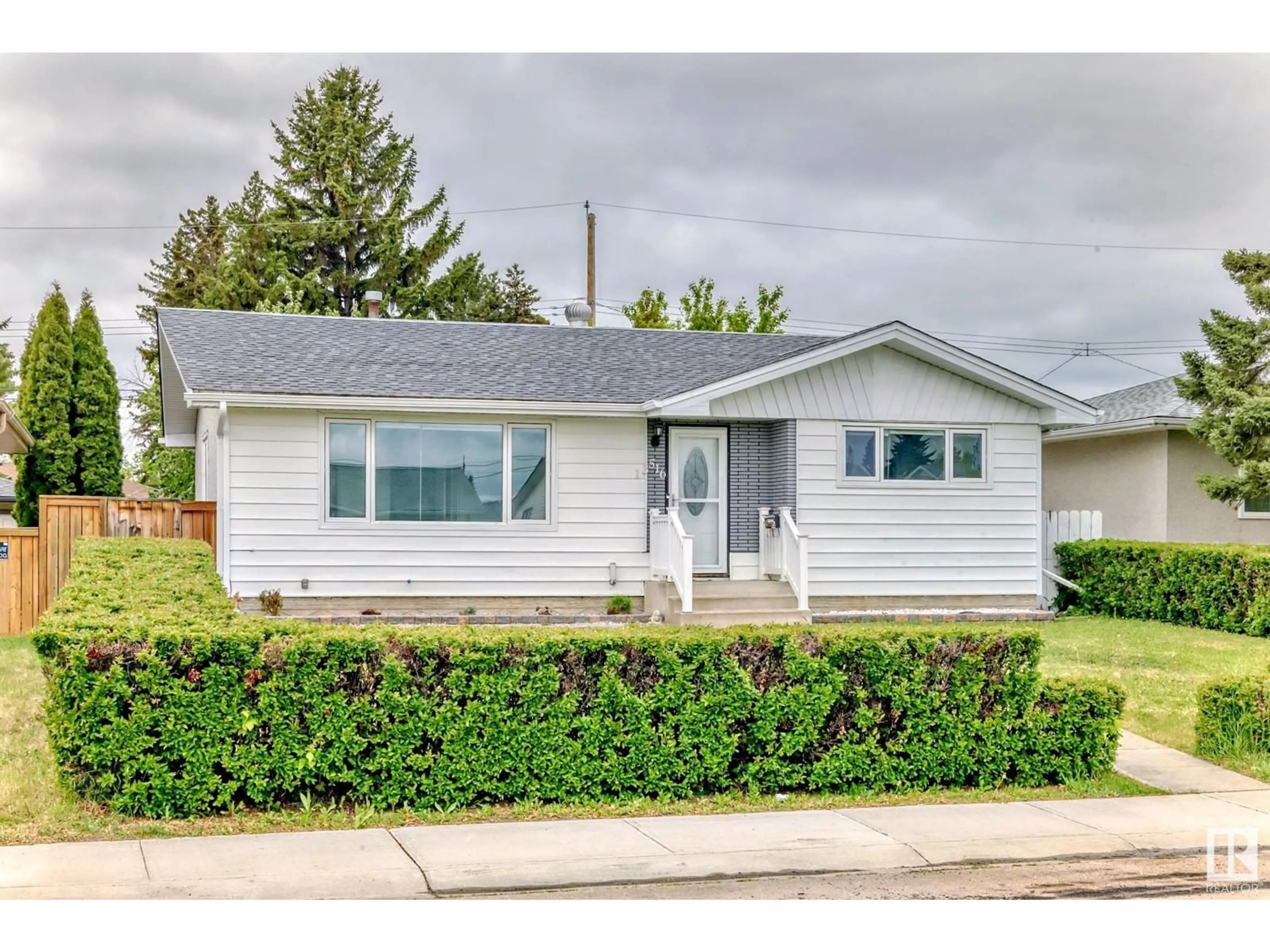 Home with vinyl exterior material, street for NW - 13516 112 ST, Edmonton Alberta T5E5A4