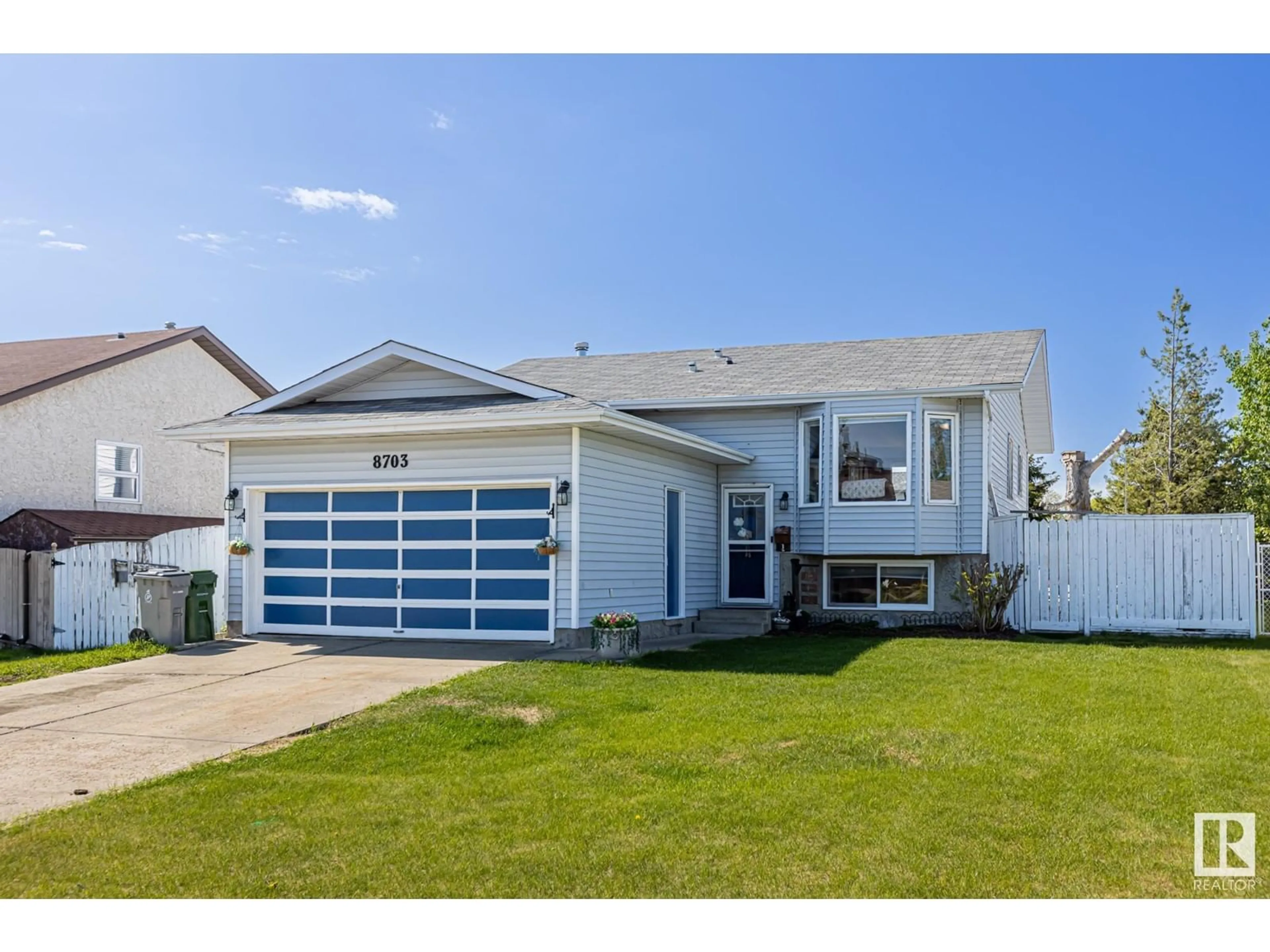 Home with vinyl exterior material, street for 8703 104 AV, Morinville Alberta T8R1C4