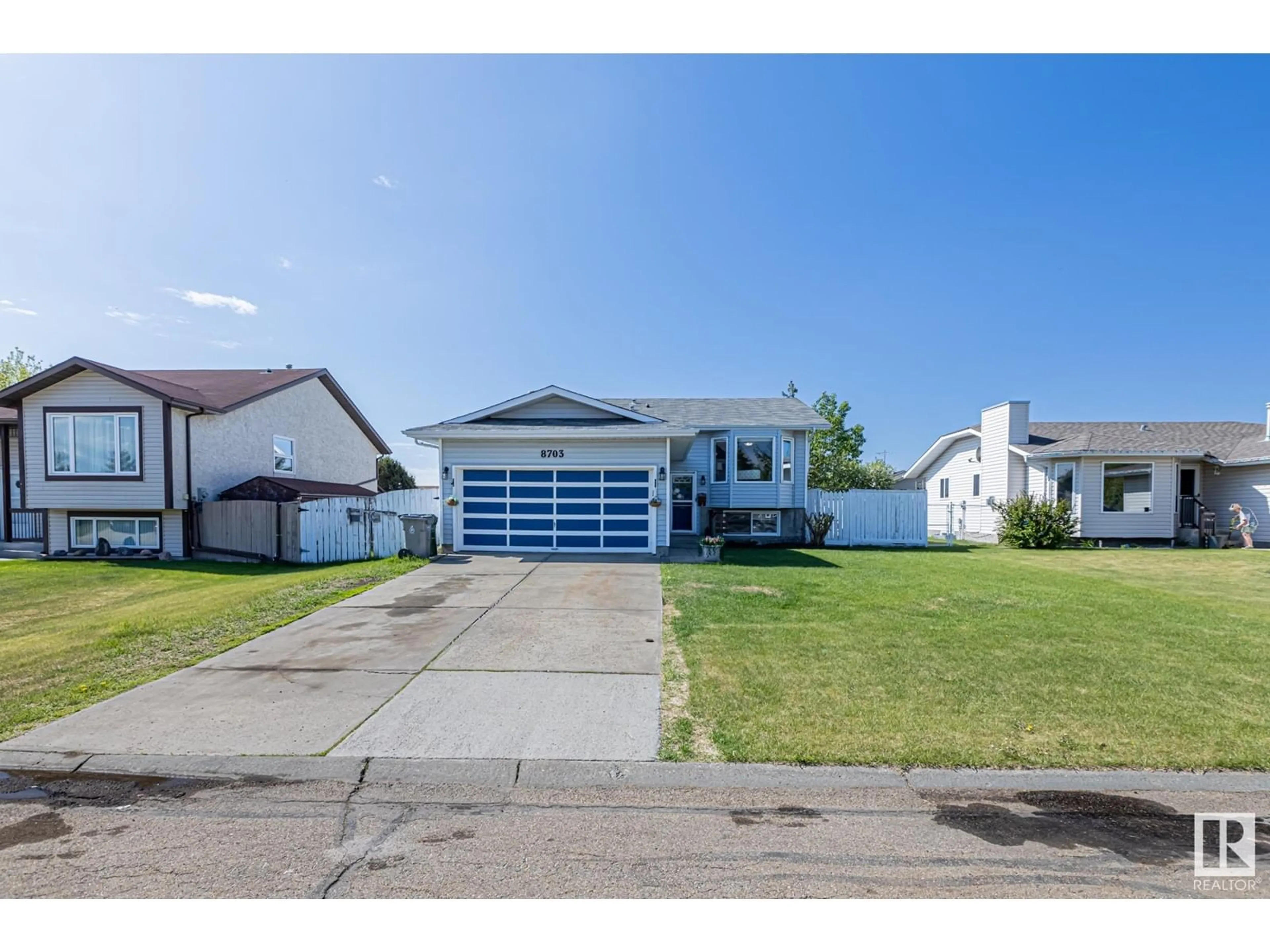 Home with vinyl exterior material, street for 8703 104 AV, Morinville Alberta T8R1C4