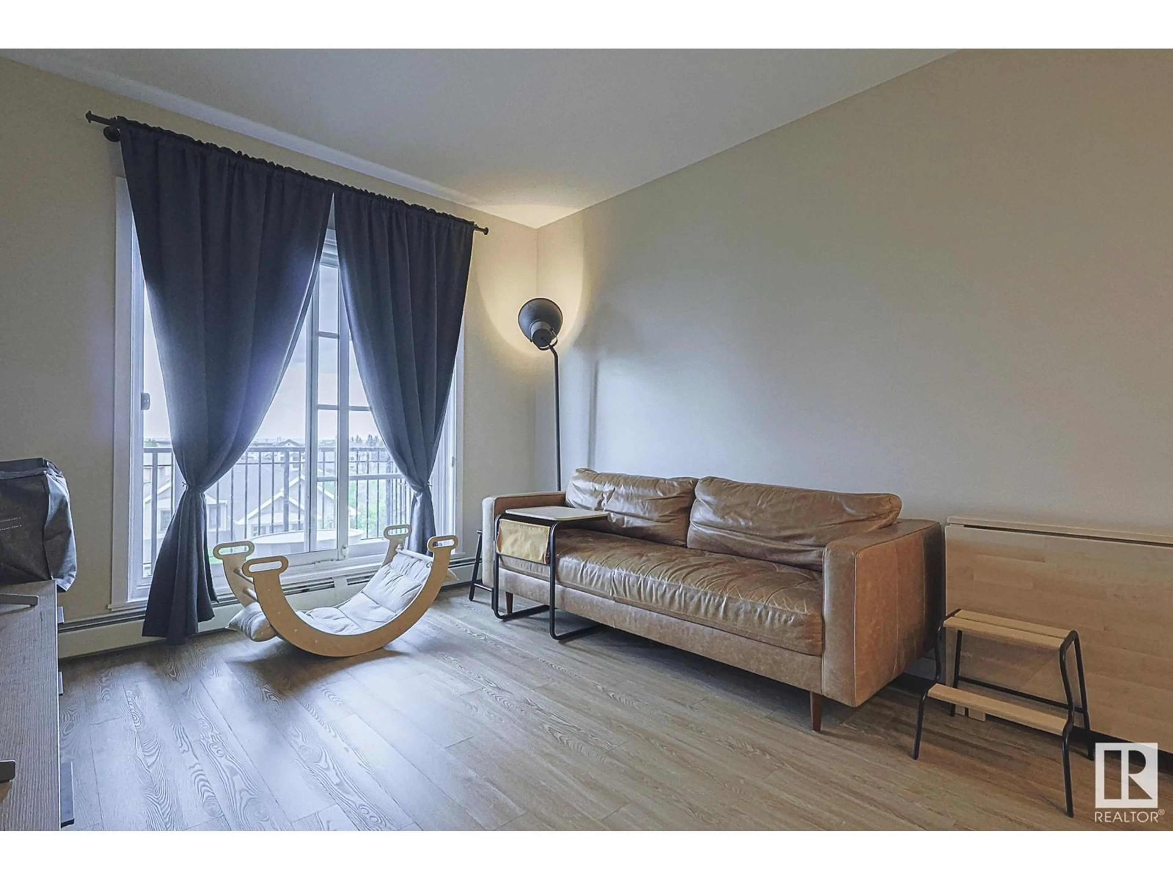 Living room with furniture, wood/laminate floor for #426 - 1154 ADAMSON DR, Edmonton Alberta T6W3N5