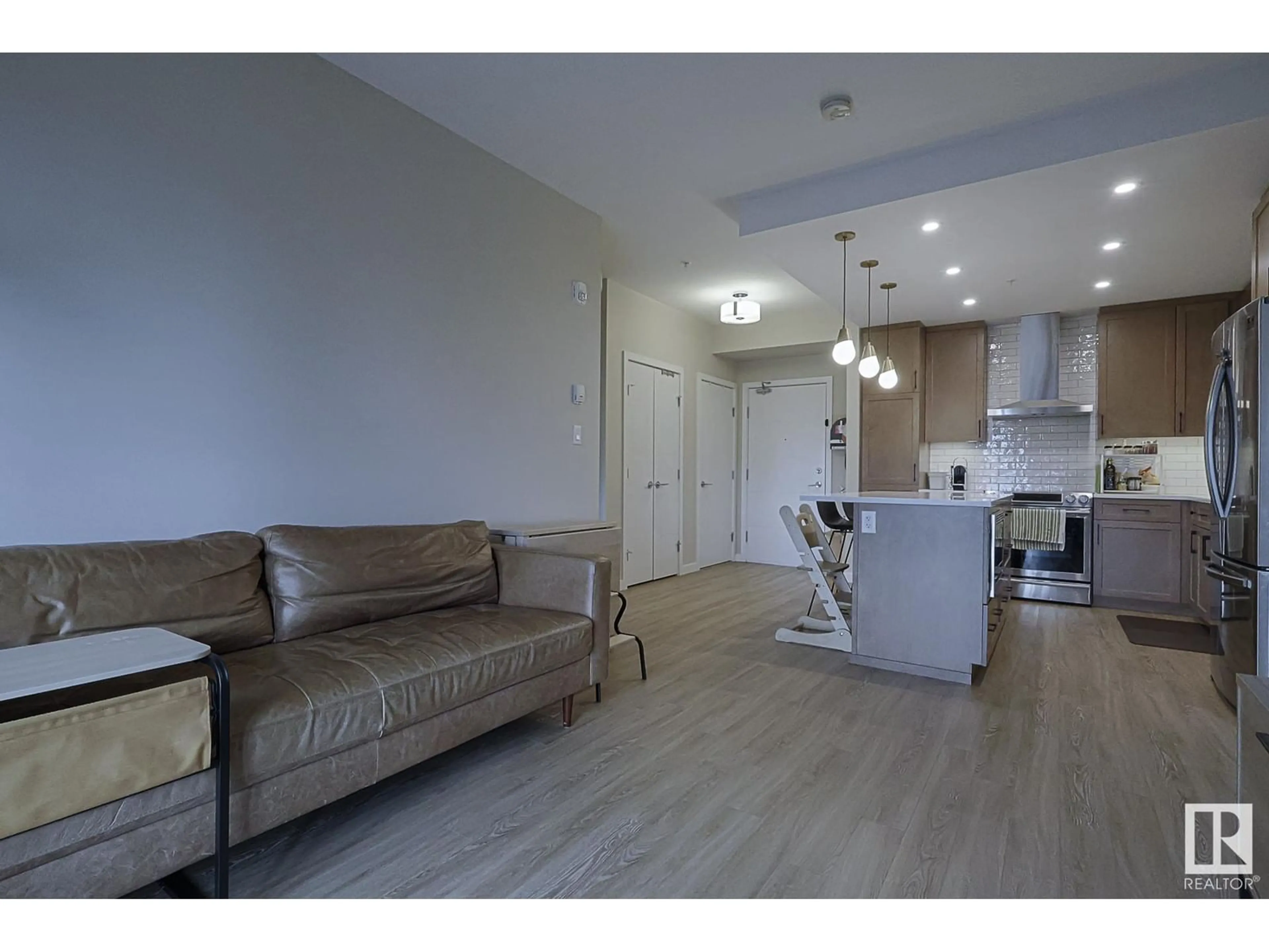 Living room with furniture, wood/laminate floor for #426 - 1154 ADAMSON DR, Edmonton Alberta T6W3N5