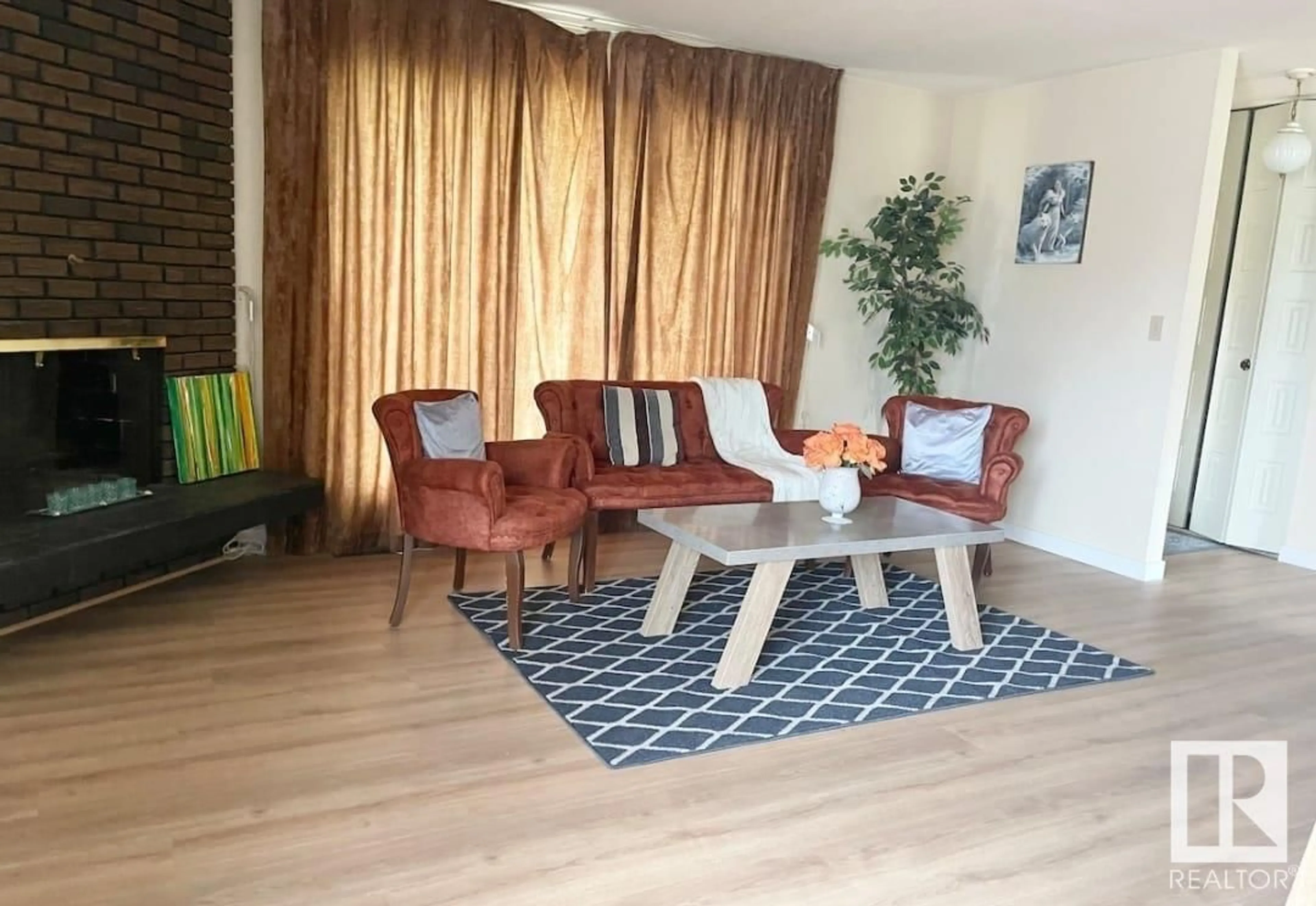 Living room with furniture, wood/laminate floor for 14139 30 ST, Edmonton Alberta T5Y1M6