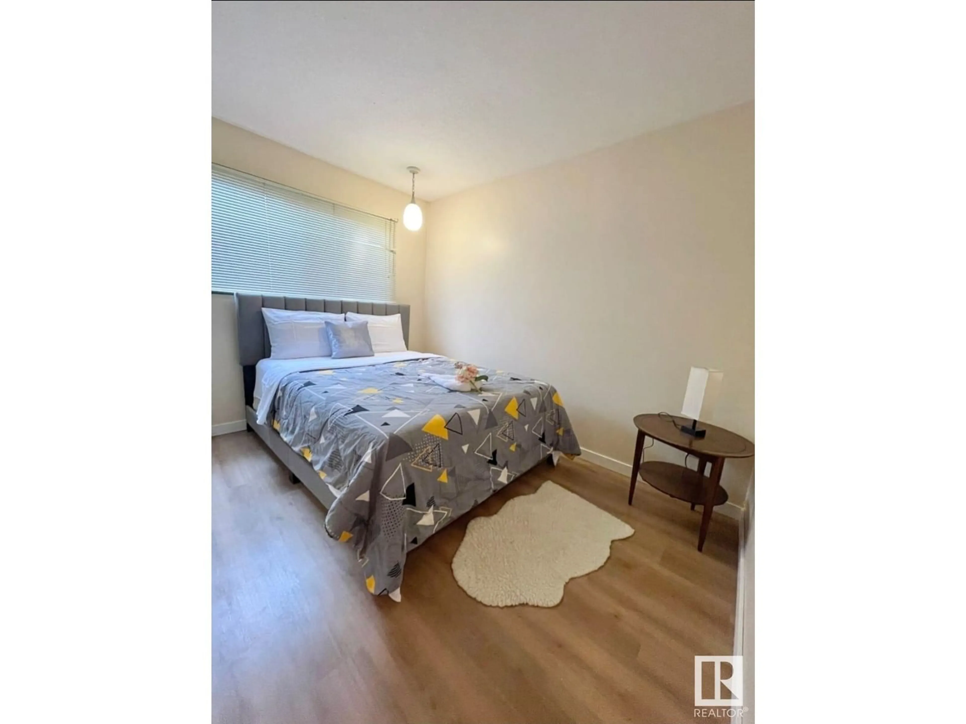 Bedroom with bed, wood/laminate floor for 14139 30 ST, Edmonton Alberta T5Y1M6