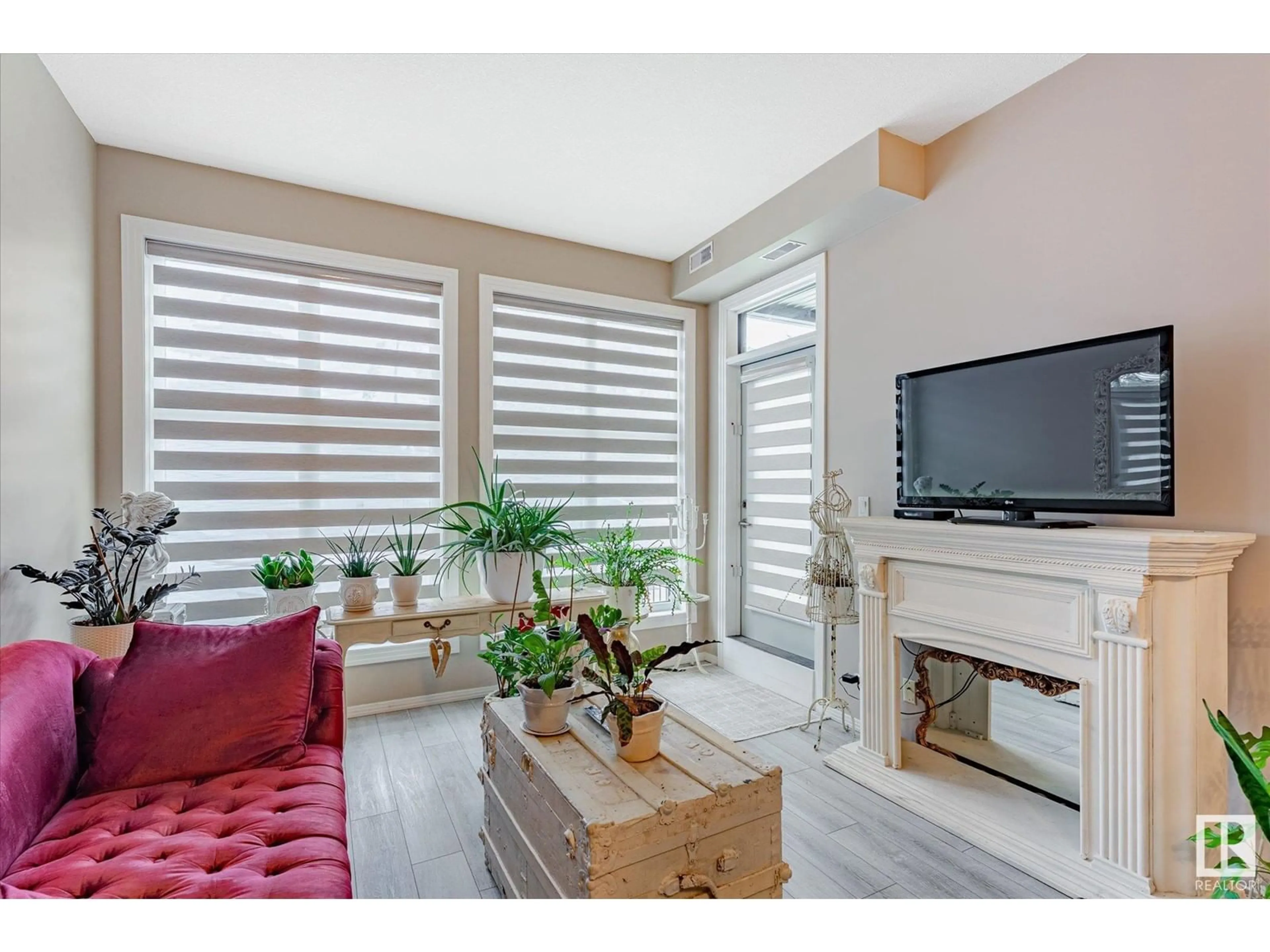 Living room with furniture, wood/laminate floor for #103 - 10531 117 ST, Edmonton Alberta T5H0A8