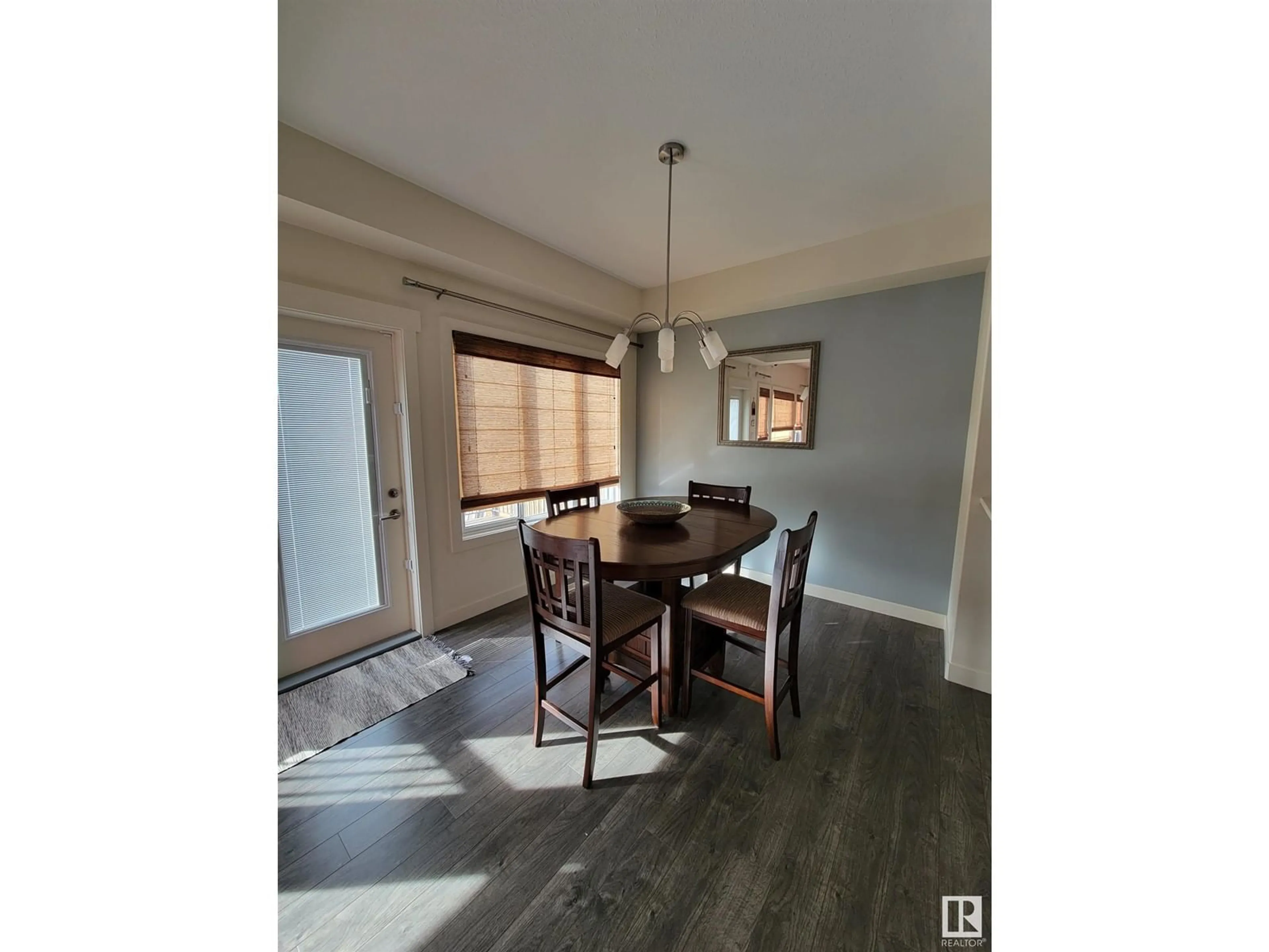 Dining room, wood/laminate floor for 722 CHARLESWORTH WY, Edmonton Alberta T6X2E9