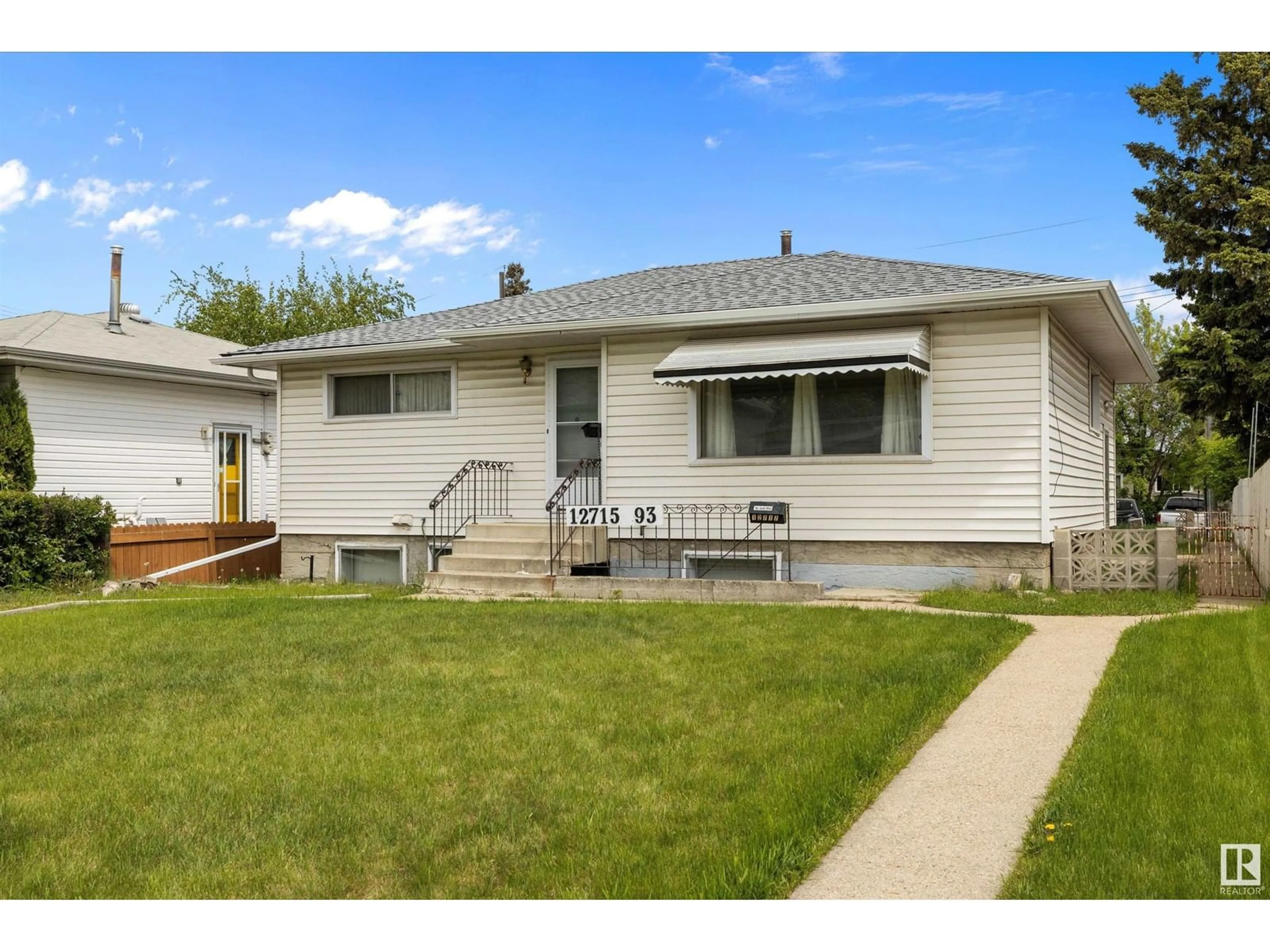 Home with vinyl exterior material, street for NW - 12715 / 12717 93 ST, Edmonton Alberta T5E3S9