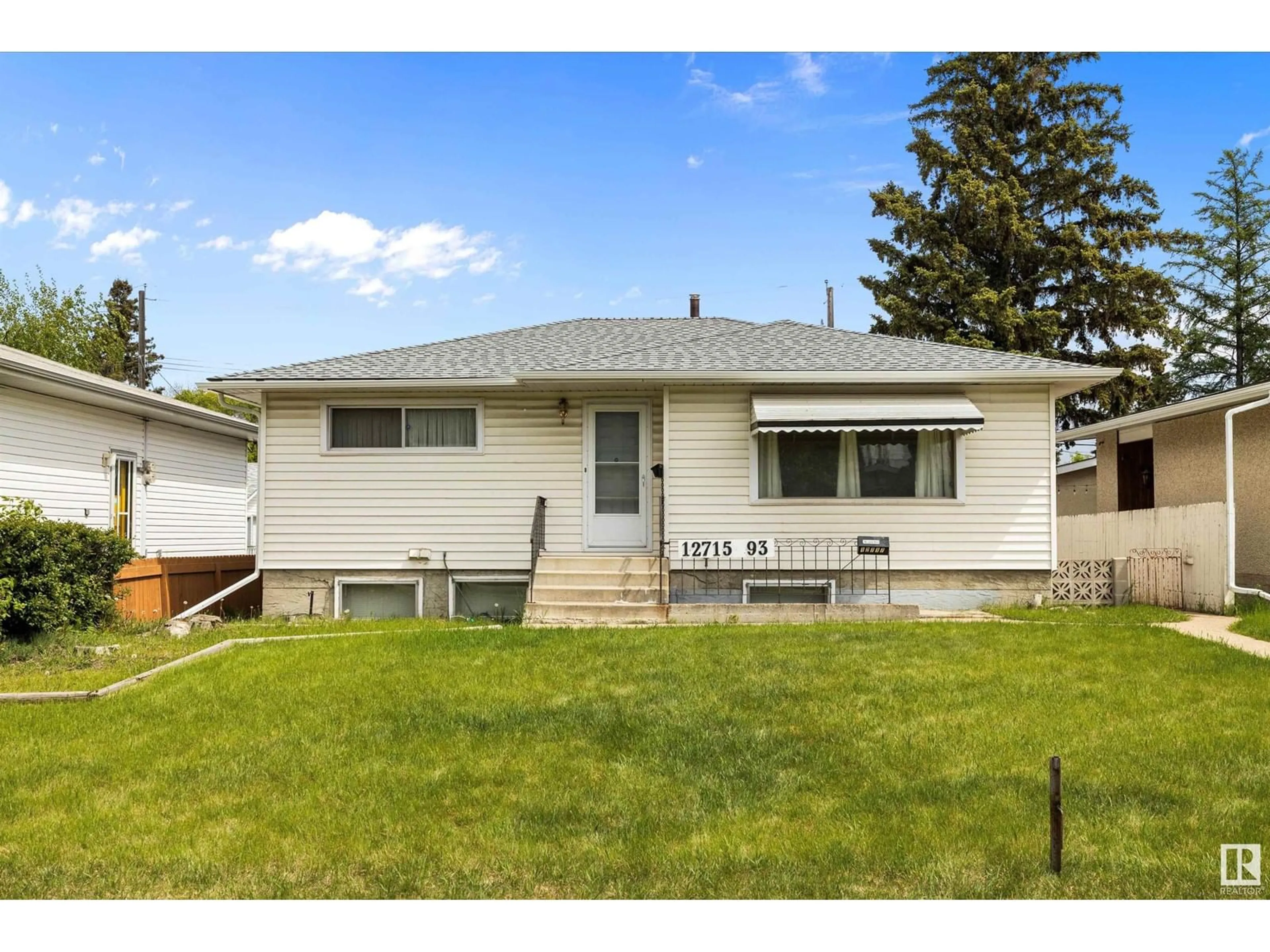 Home with vinyl exterior material, street for NW - 12715 / 12717 93 ST, Edmonton Alberta T5E3S9