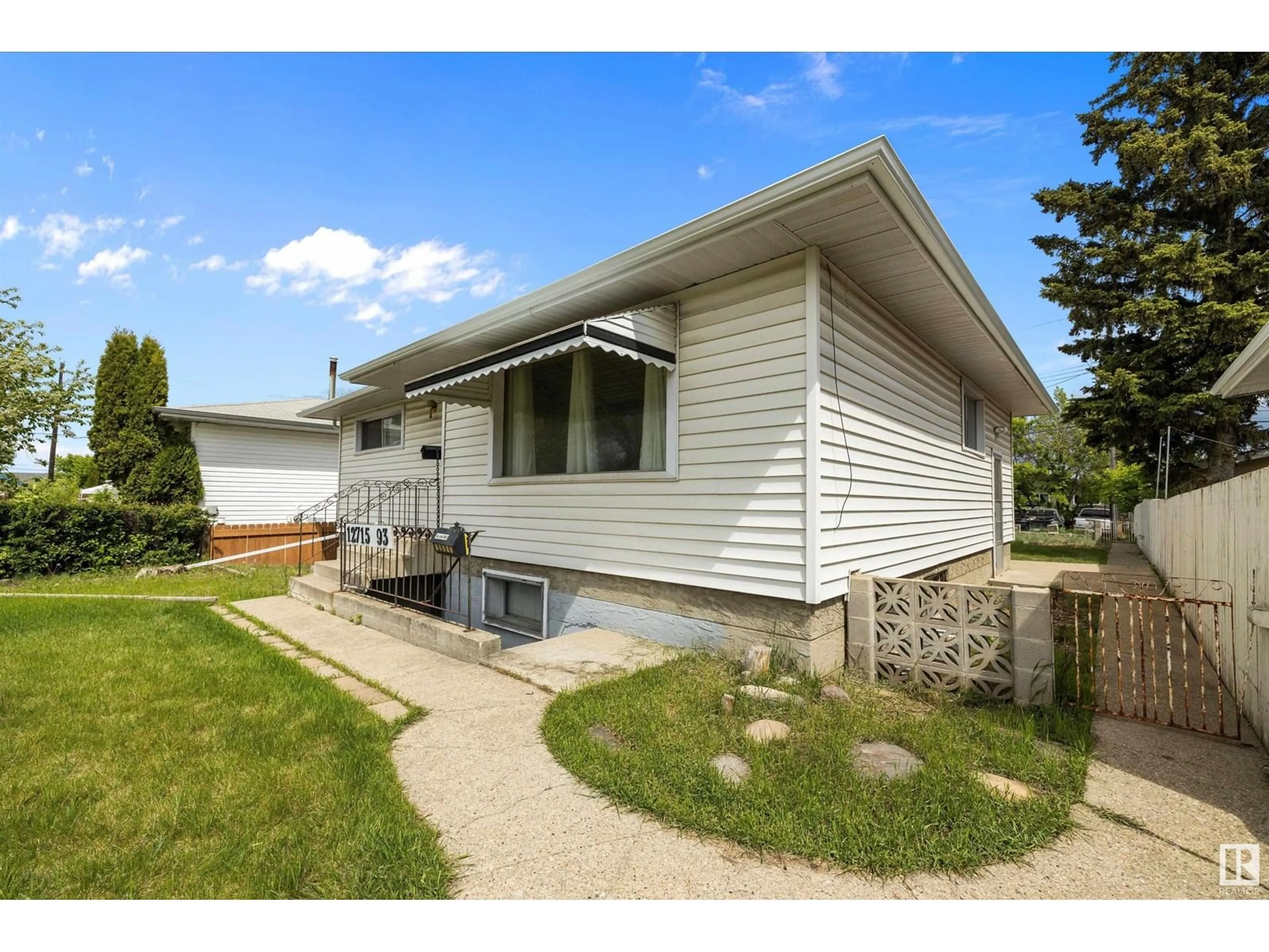 Home with vinyl exterior material, street for NW - 12715 / 12717 93 ST, Edmonton Alberta T5E3S9