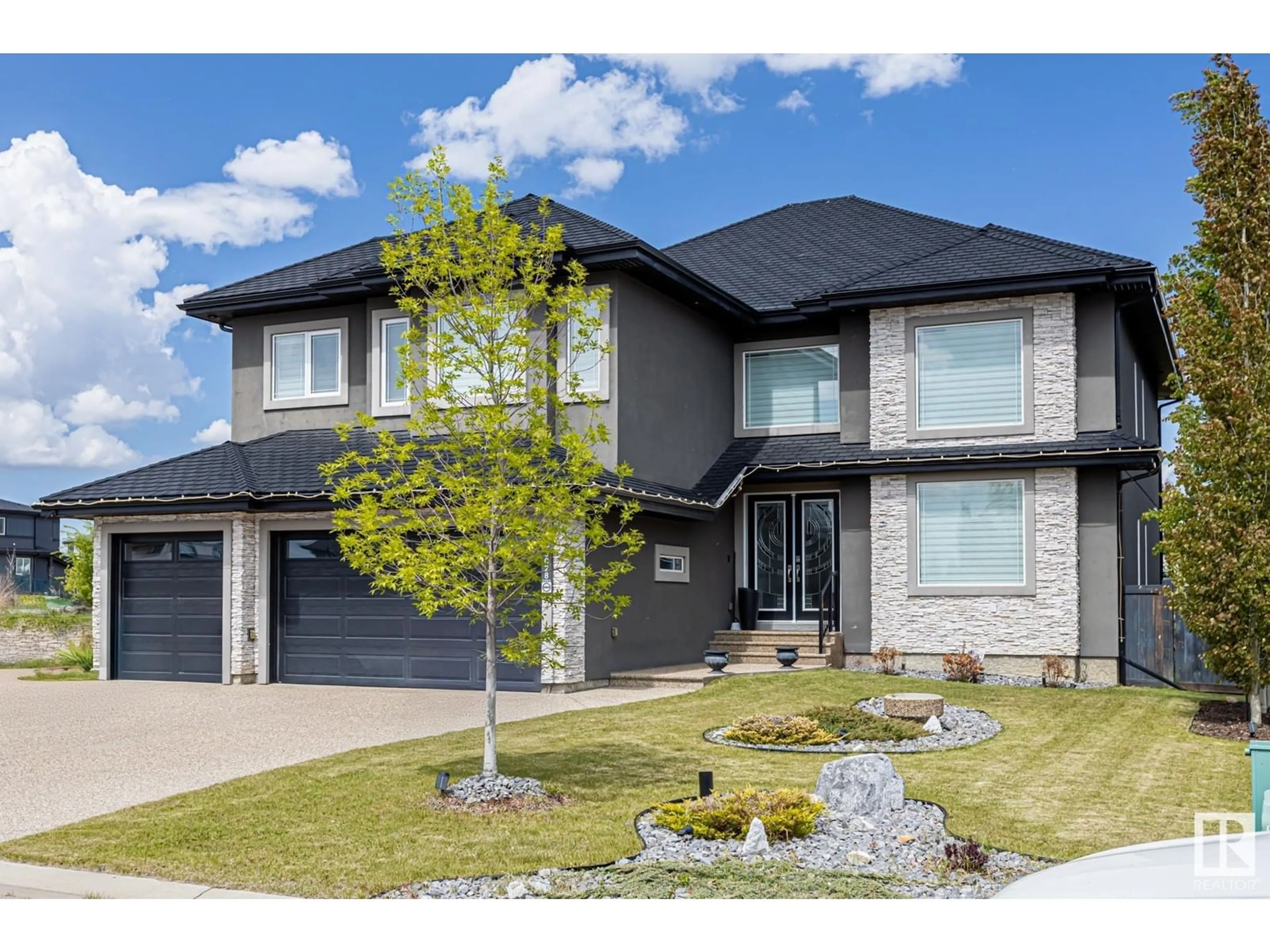 Home with brick exterior material, street for 3028 59 AV, Rural Leduc County Alberta T4X0X9