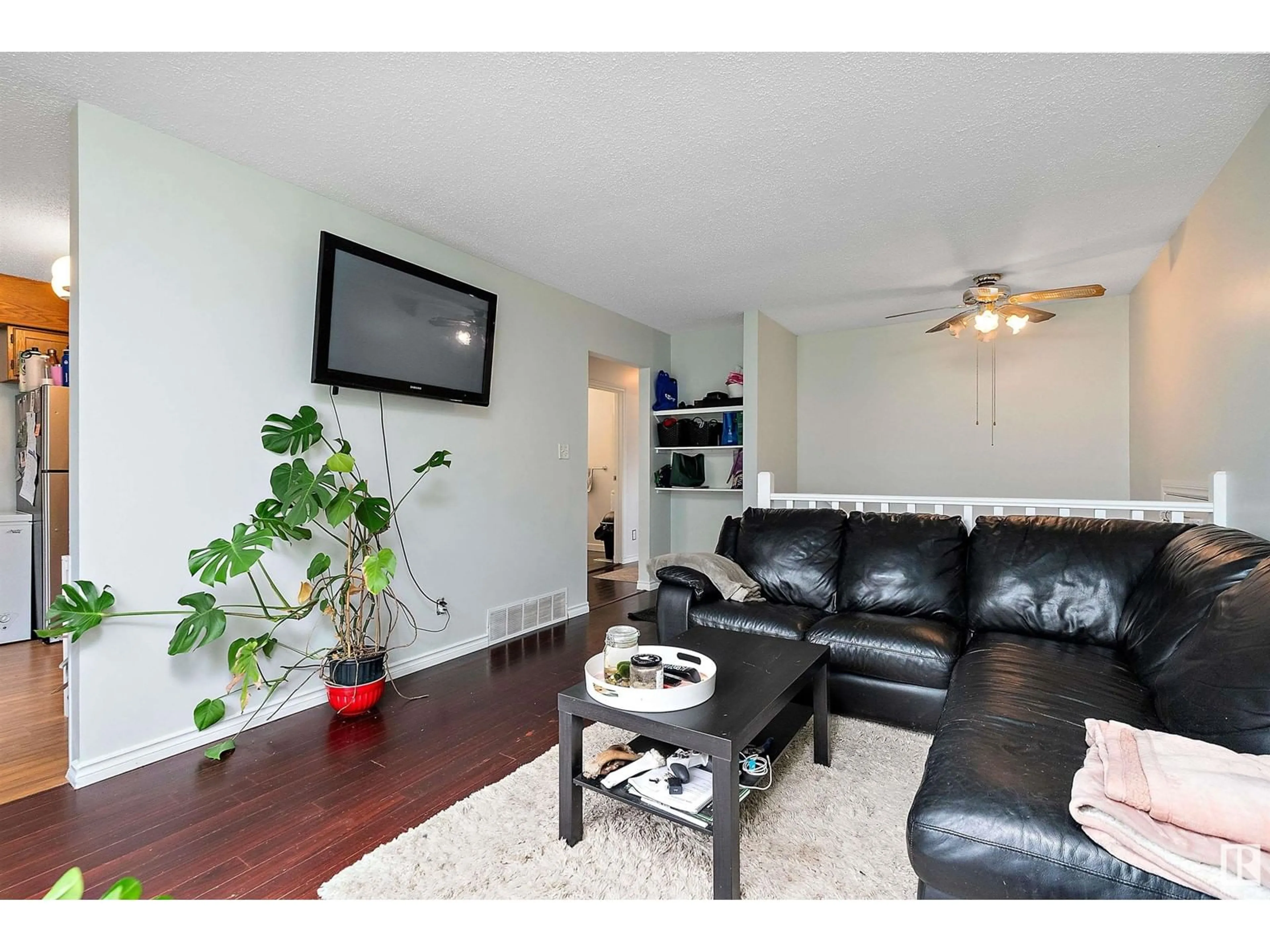 Living room with furniture, wood/laminate floor for NW - 16503 115 ST, Edmonton Alberta T5X3V3