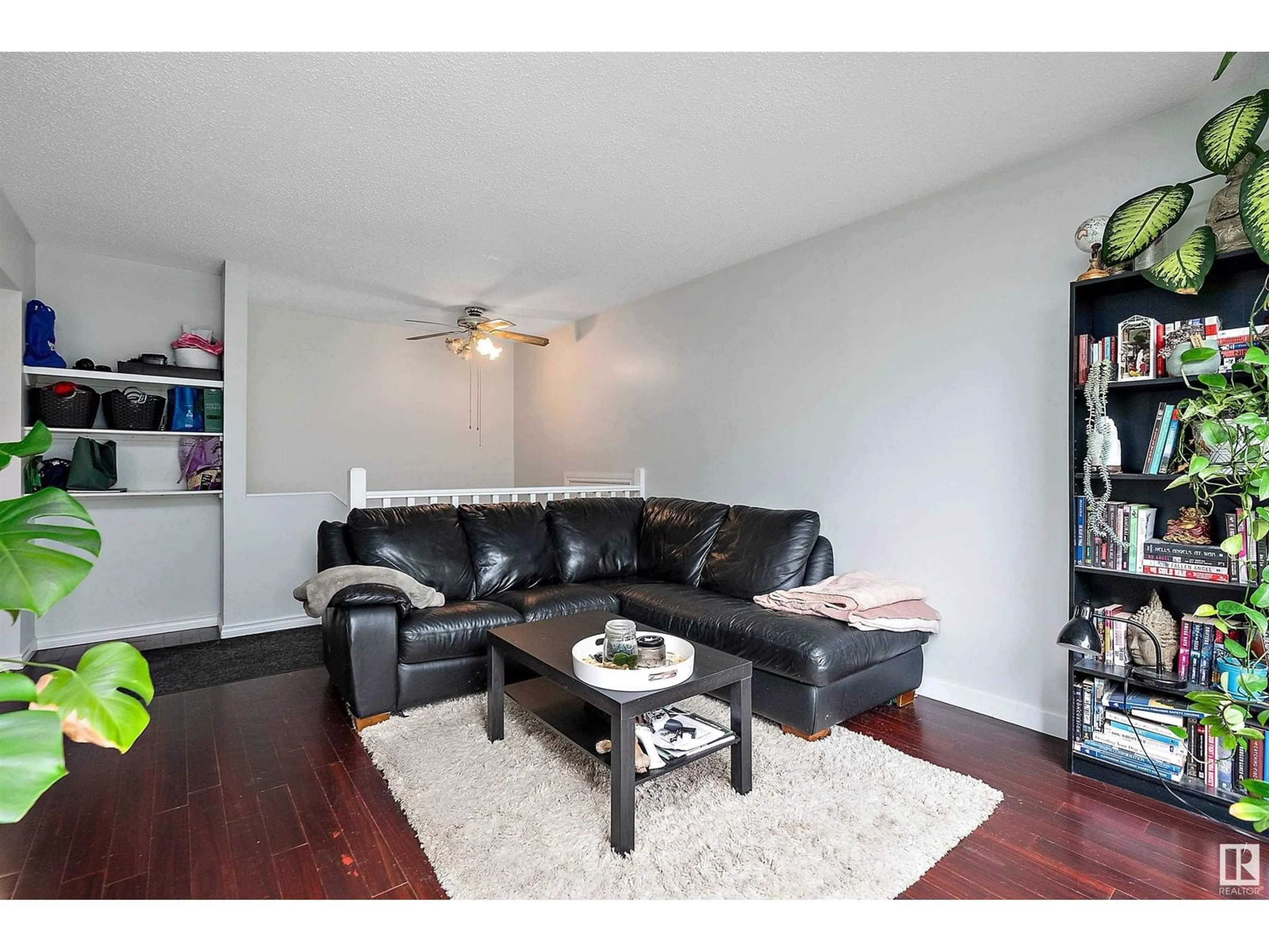 Living room with furniture, wood/laminate floor for NW - 16503 115 ST, Edmonton Alberta T5X3V3