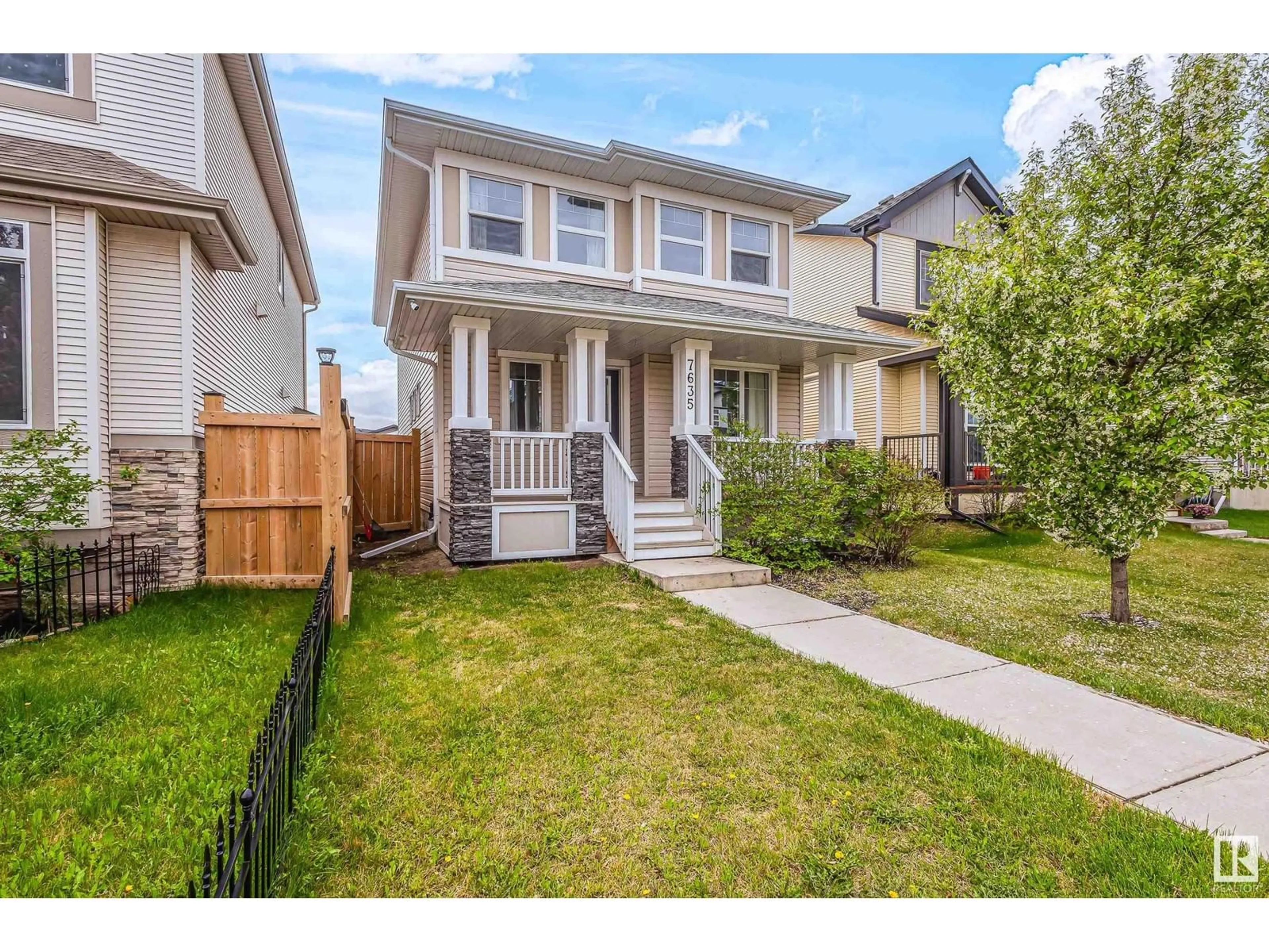 Home with vinyl exterior material, street for 7635 182 AV NW, Edmonton Alberta T5Z0M1