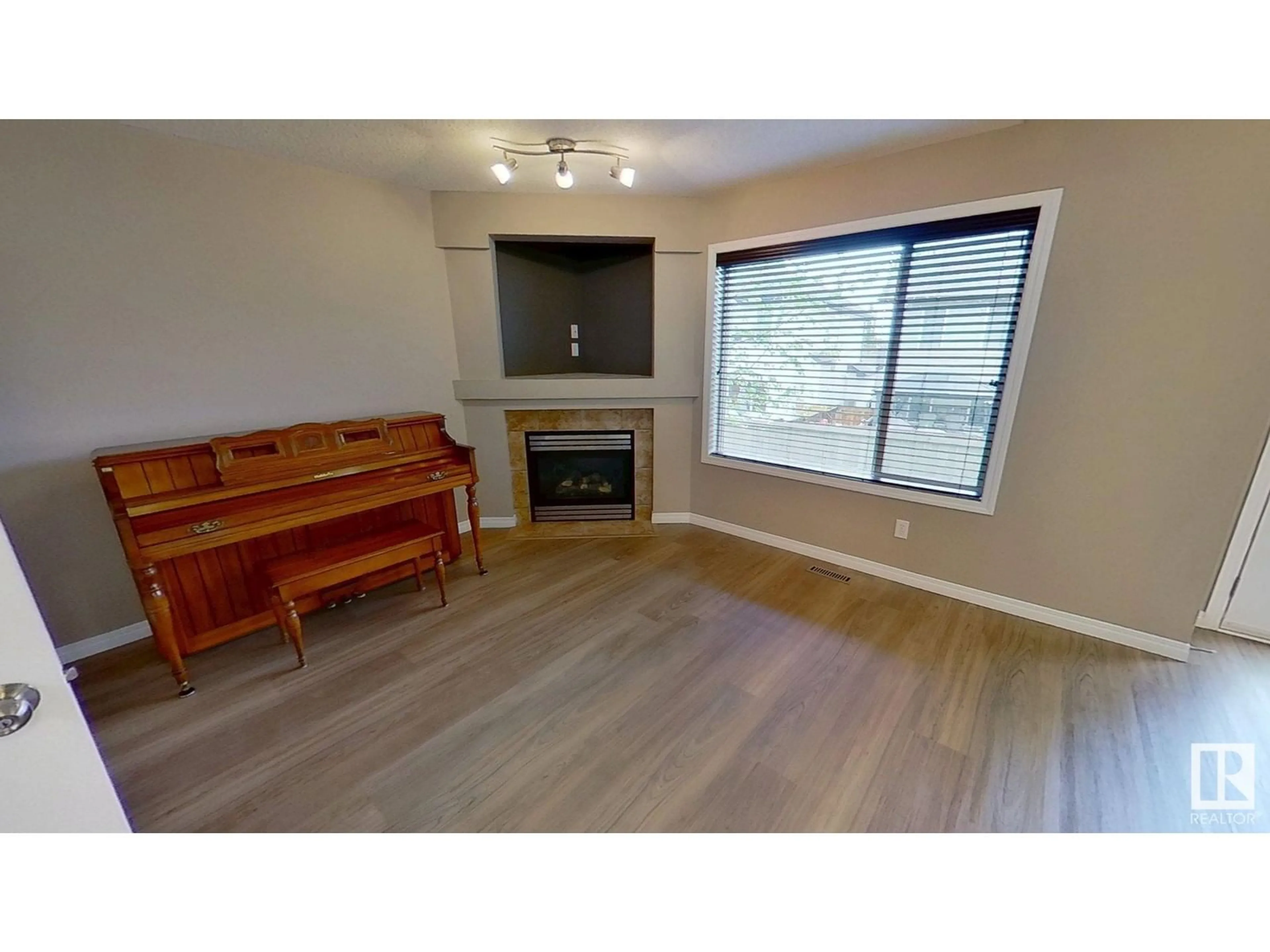 Living room with furniture, wood/laminate floor for 112 21 SUMMERWOOD DR, Sherwood Park Alberta T8H0C5