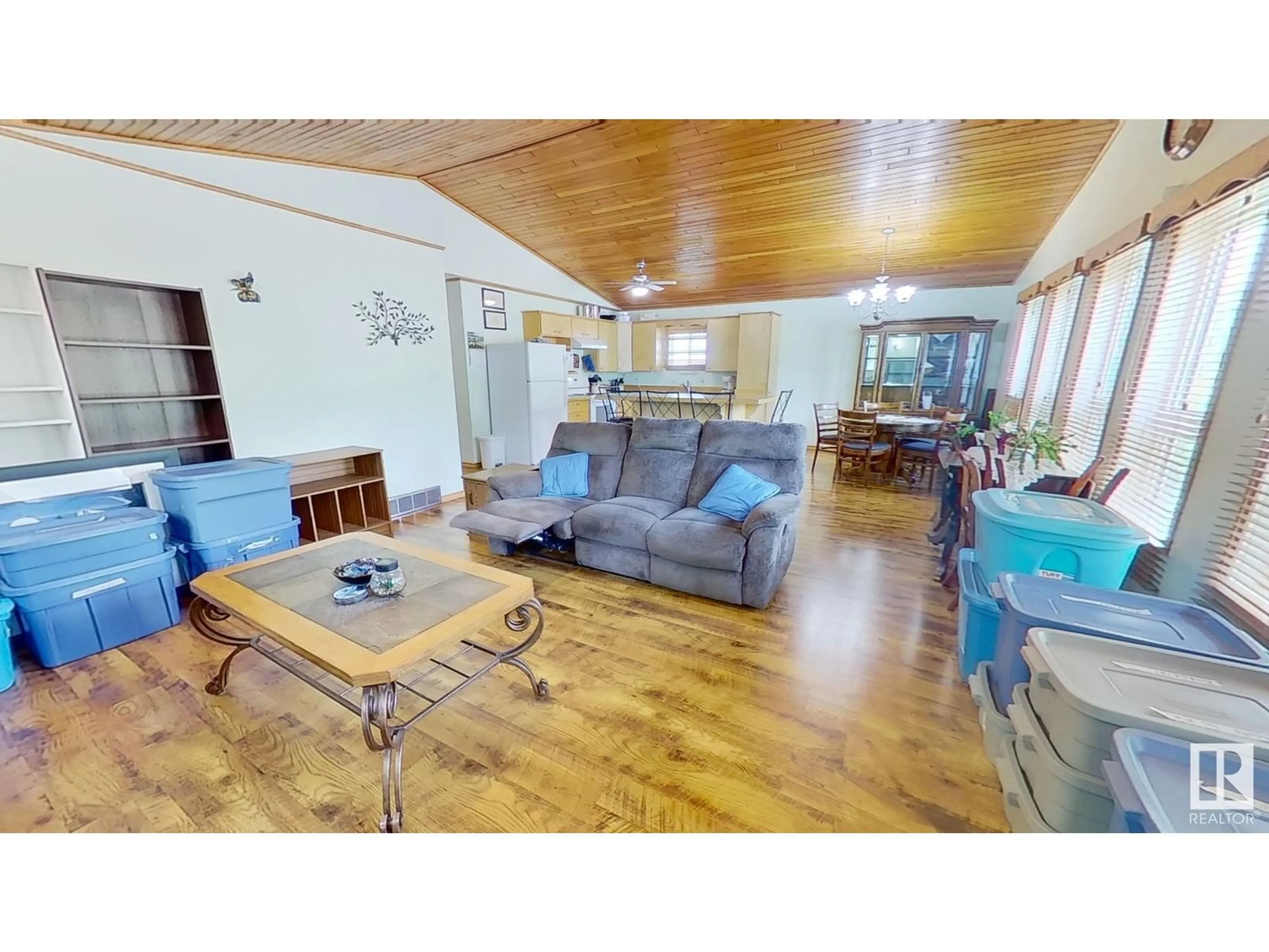 Living room with furniture, wood/laminate floor for 4815 51 AV, Breton Alberta T0C0P0