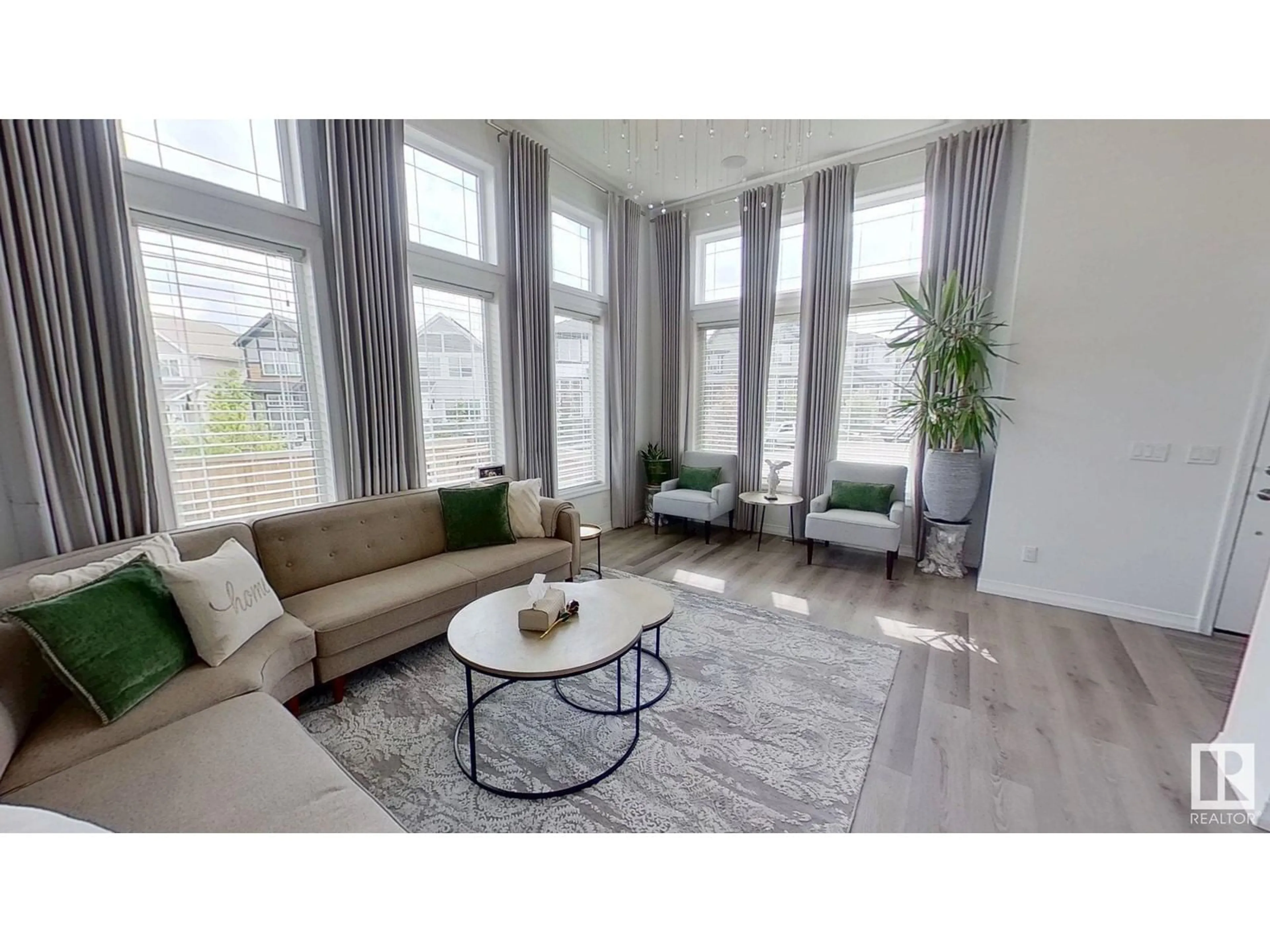 Living room with furniture, wood/laminate floor for NW - 20932 130 AV, Edmonton Alberta T5S0L4