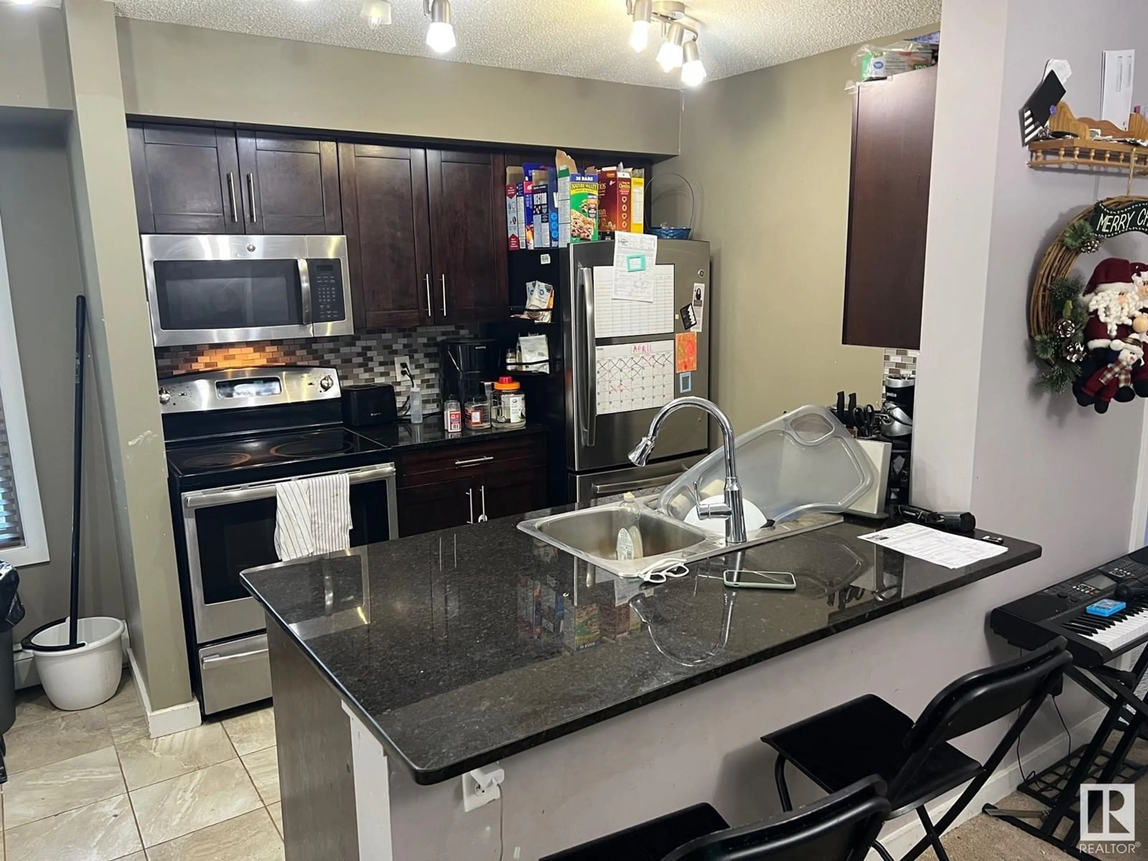 Open concept kitchen, ceramic/tile floor for #101 - 107 WATT CM, Edmonton Alberta T6X2C6