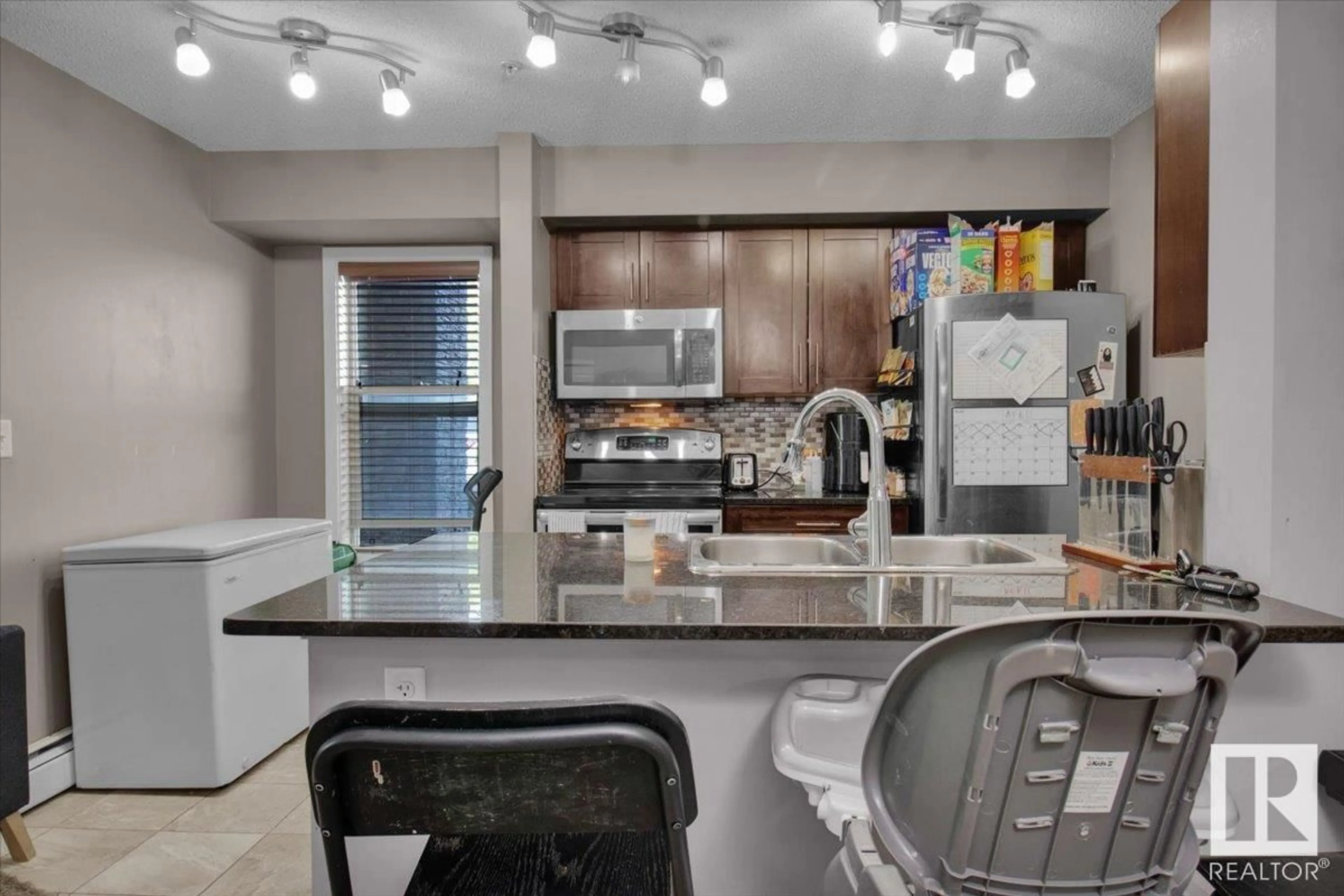 Open concept kitchen, ceramic/tile floor for #101 - 107 WATT CM, Edmonton Alberta T6X2C6