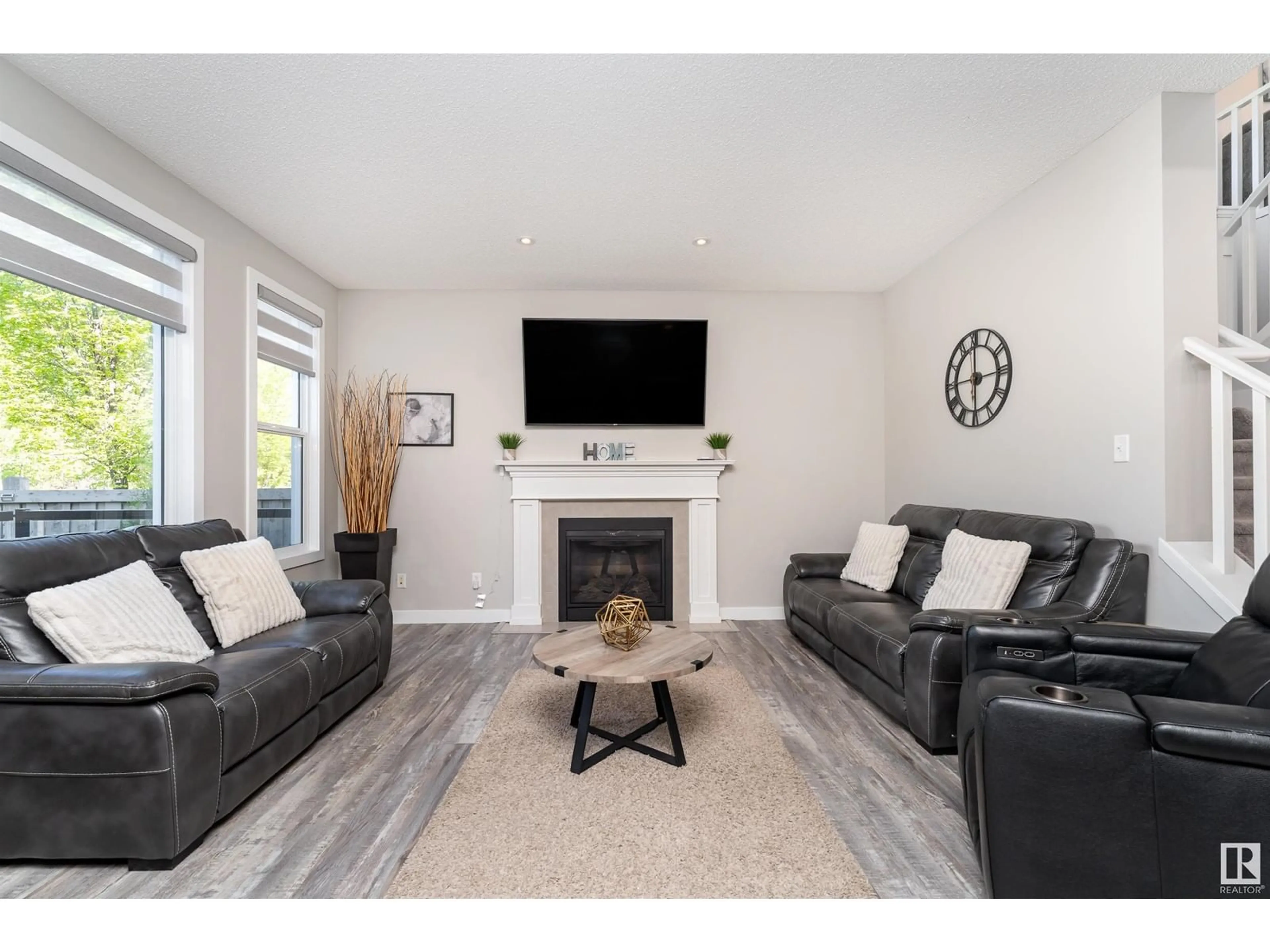 Living room with furniture, wood/laminate floor for 5533 EDWORTHY WY, Edmonton Alberta T6M0N8