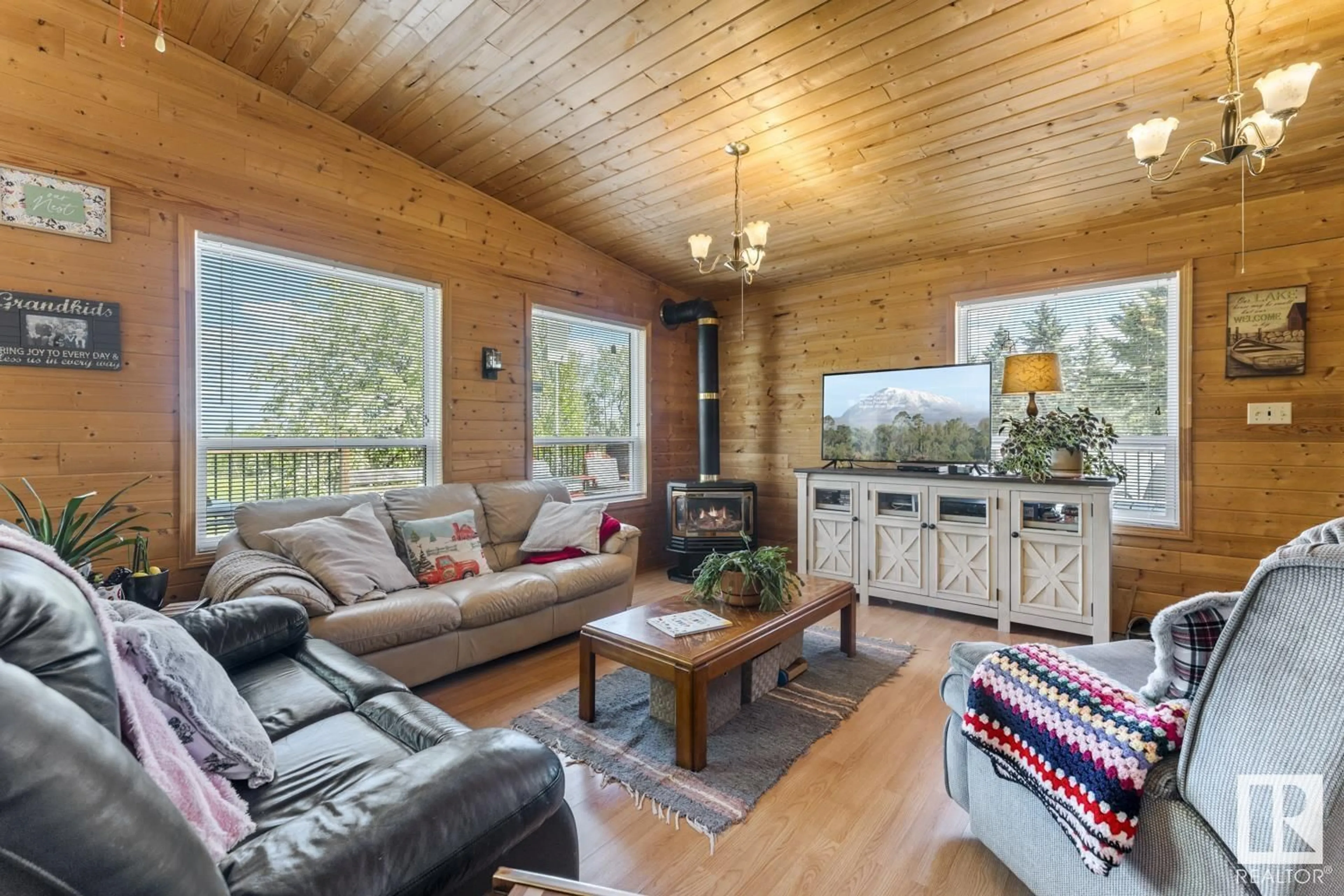 Living room with furniture, wood/laminate floor for 36 45522 TWP RD 593A, Rural Bonnyville M.D. Alberta T9N2J6