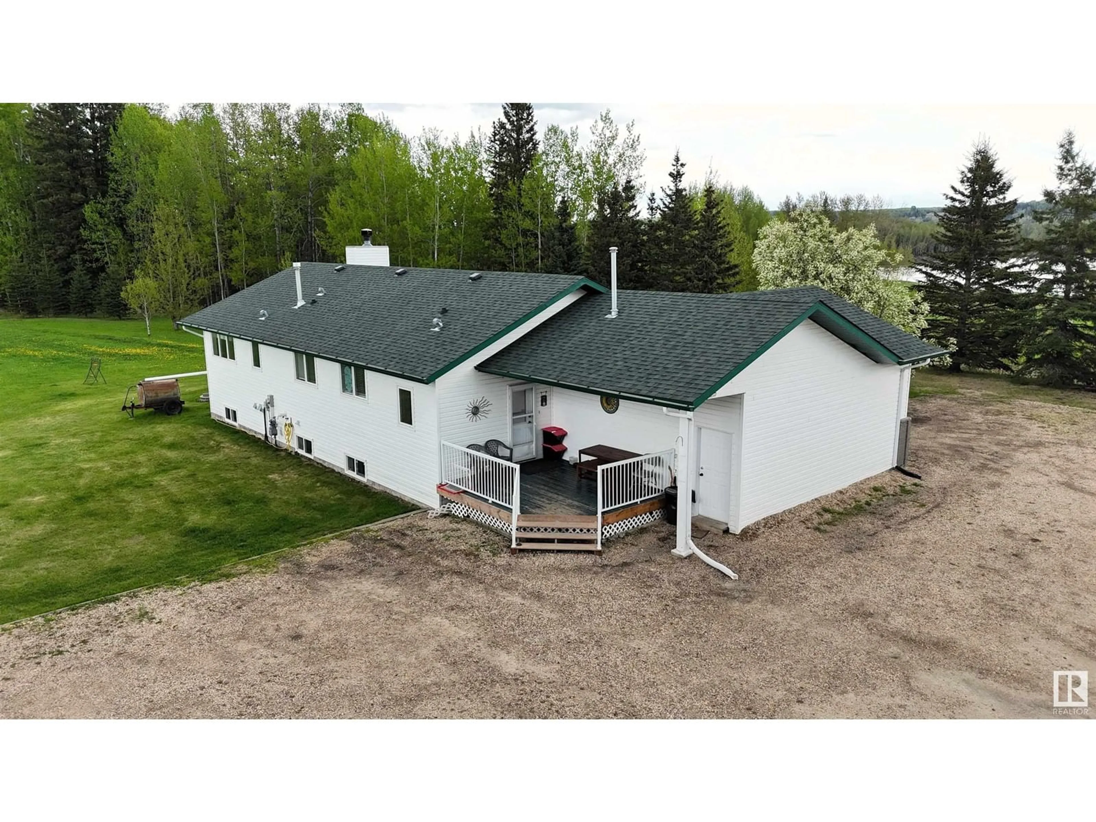 A pic from outside/outdoor area/front of a property/back of a property/a pic from drone, building for 125016 TWP ROAD 593 A, Rural Woodlands County Alberta T7S1N7