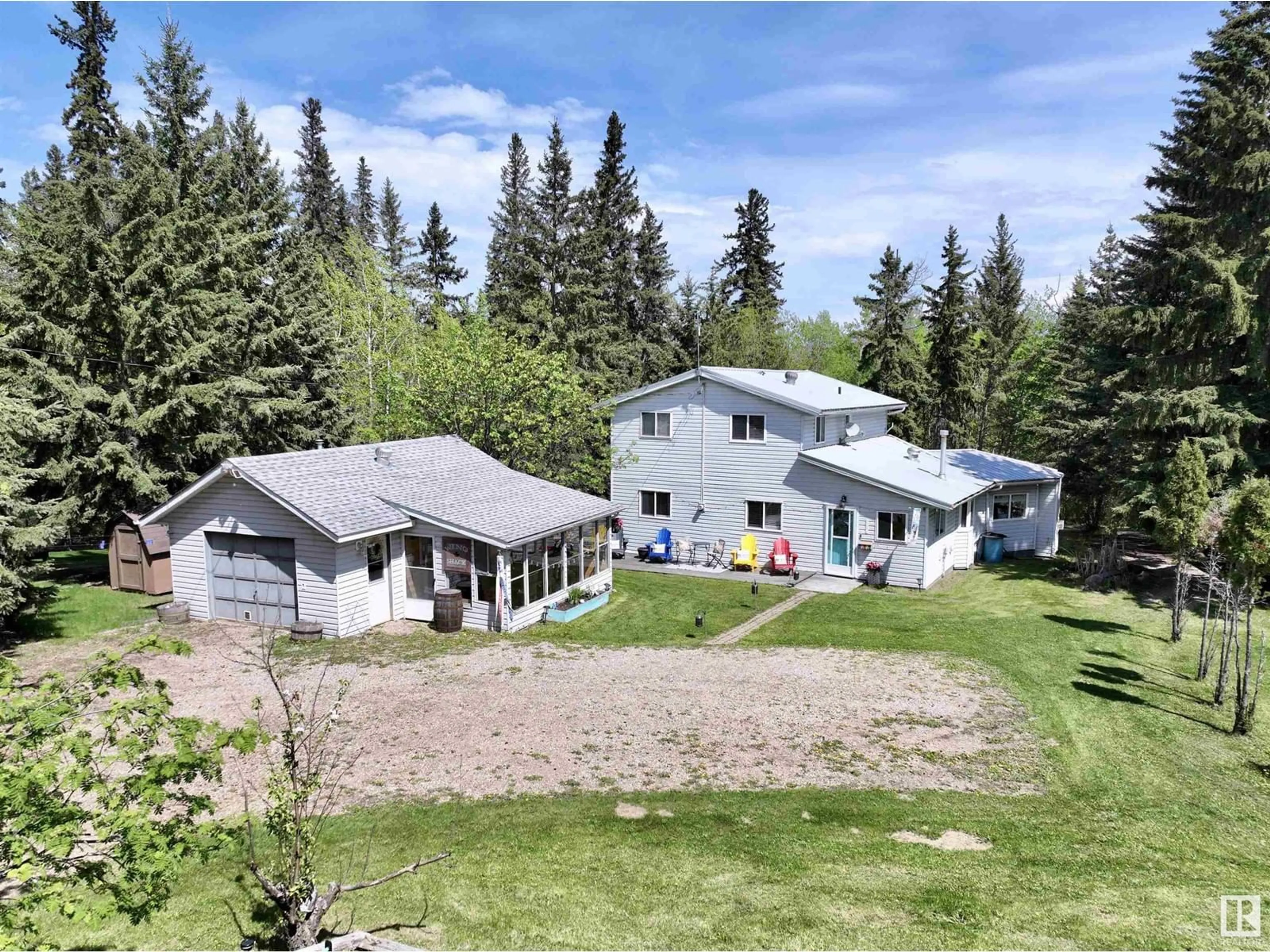 A pic from outside/outdoor area/front of a property/back of a property/a pic from drone, mountain view for 60501 - 316 RR 120, Rural St. Paul County Alberta T0A3E0