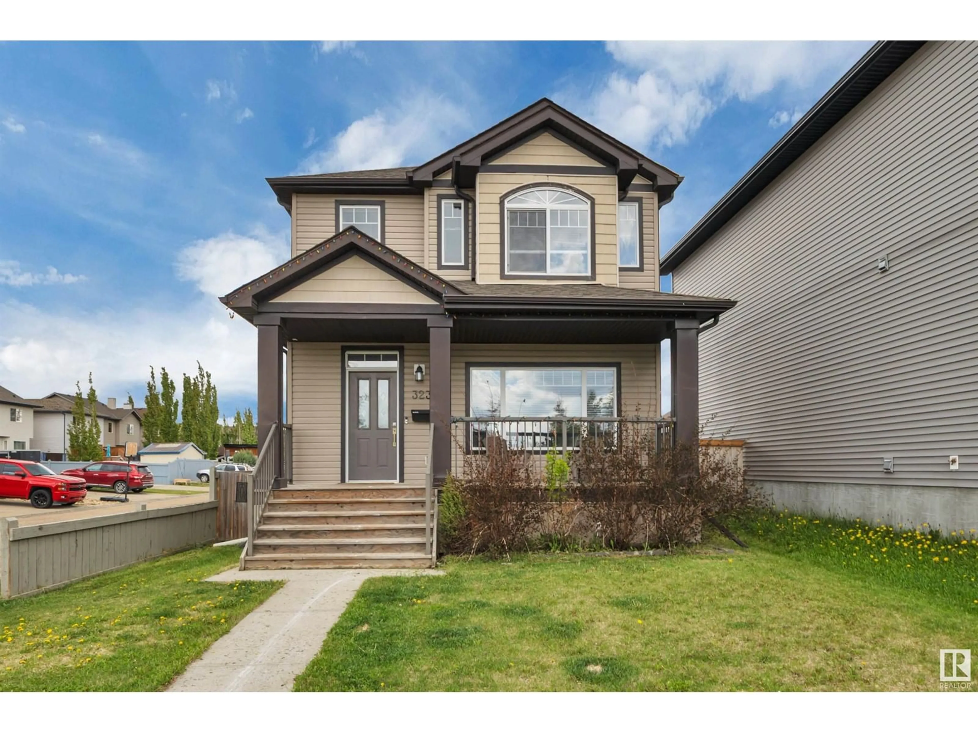 Home with vinyl exterior material, street for 323 SHERIDAN WY, Leduc Alberta T9E8R9