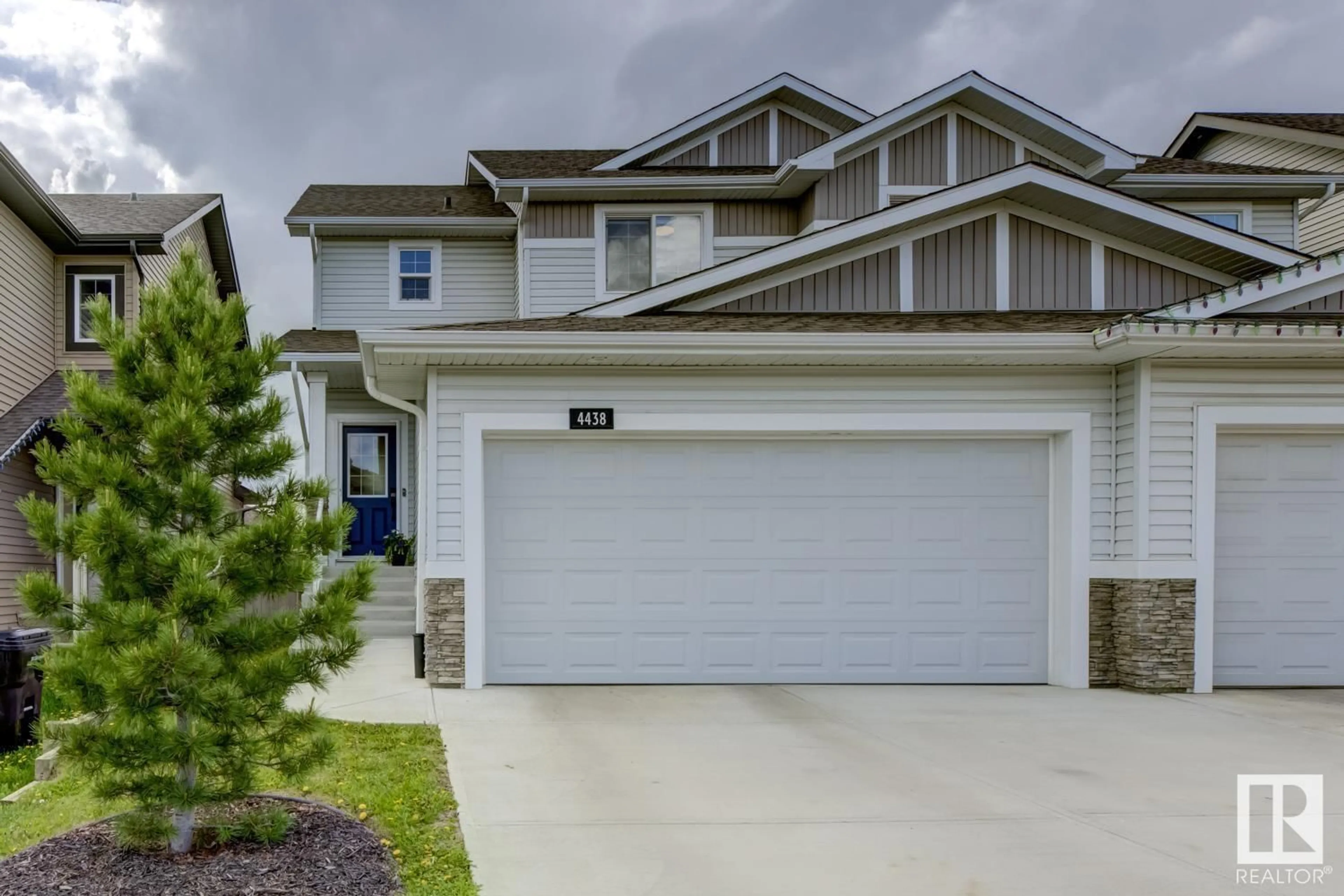 Home with vinyl exterior material, street for NW - 4438 5A ST, Edmonton Alberta T6T0Z8