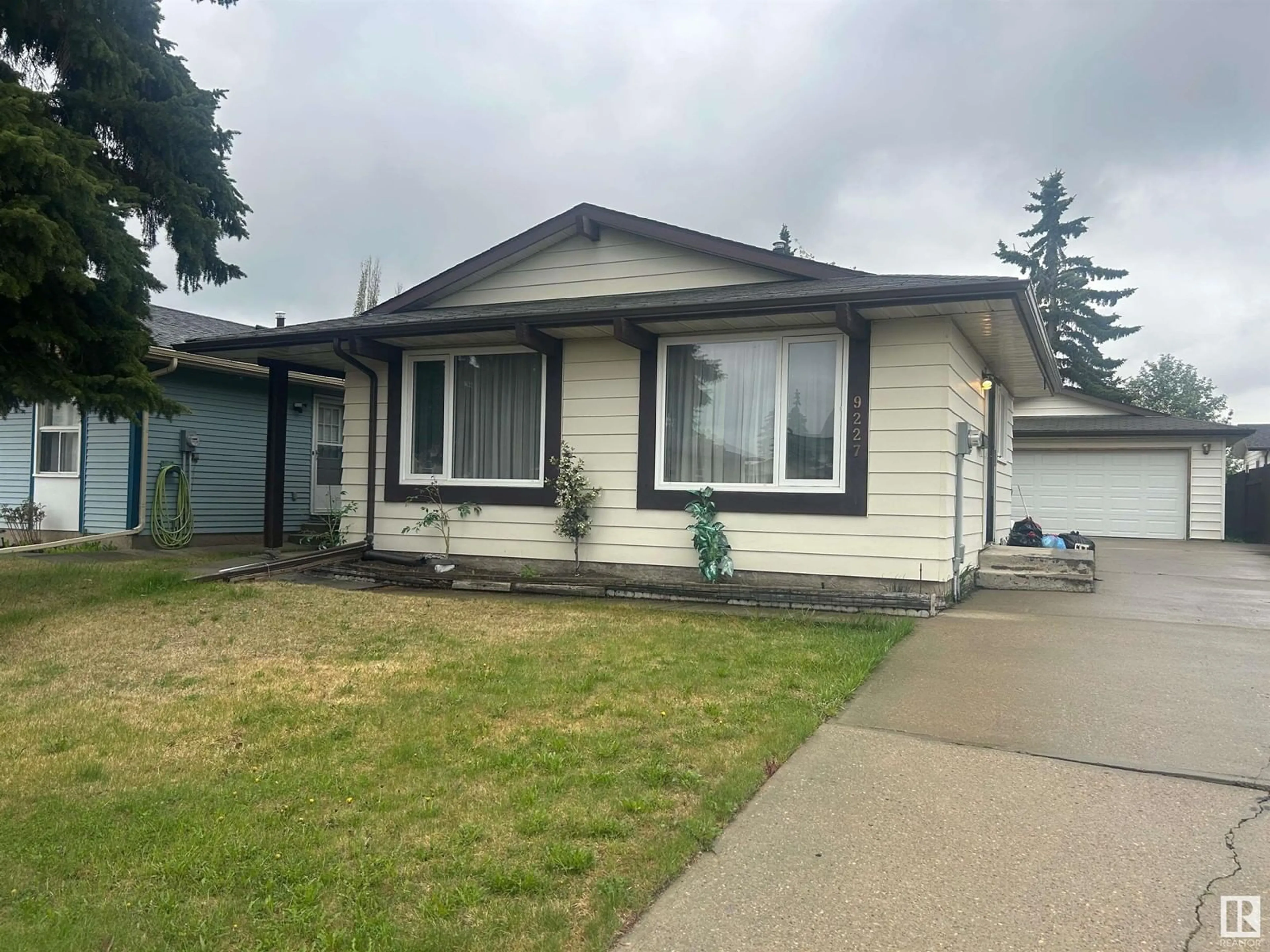 Home with vinyl exterior material, street for 9227 170 AV, Edmonton Alberta T5Z1C9