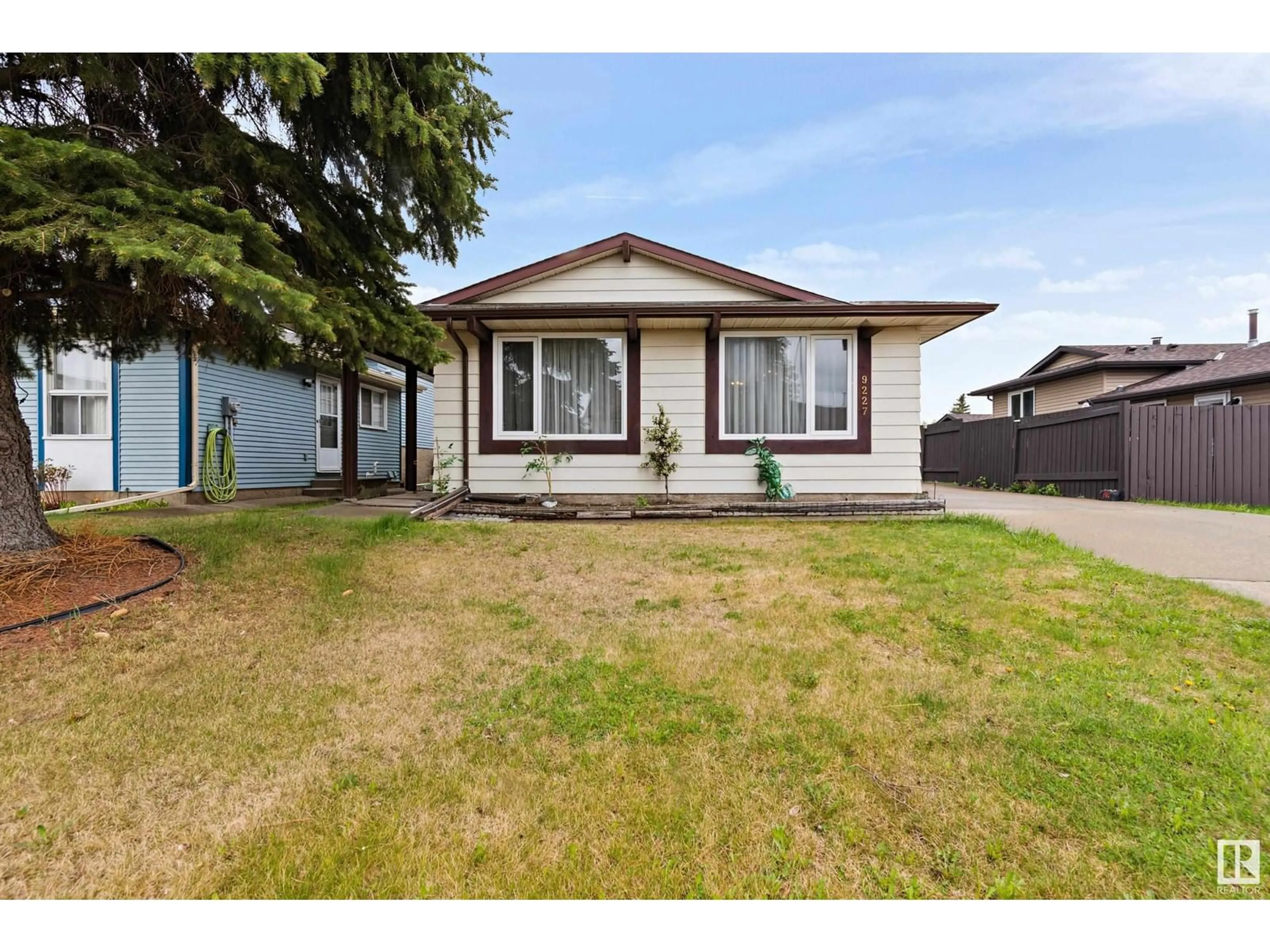 Home with vinyl exterior material, street for 9227 170 AV, Edmonton Alberta T5Z1C9