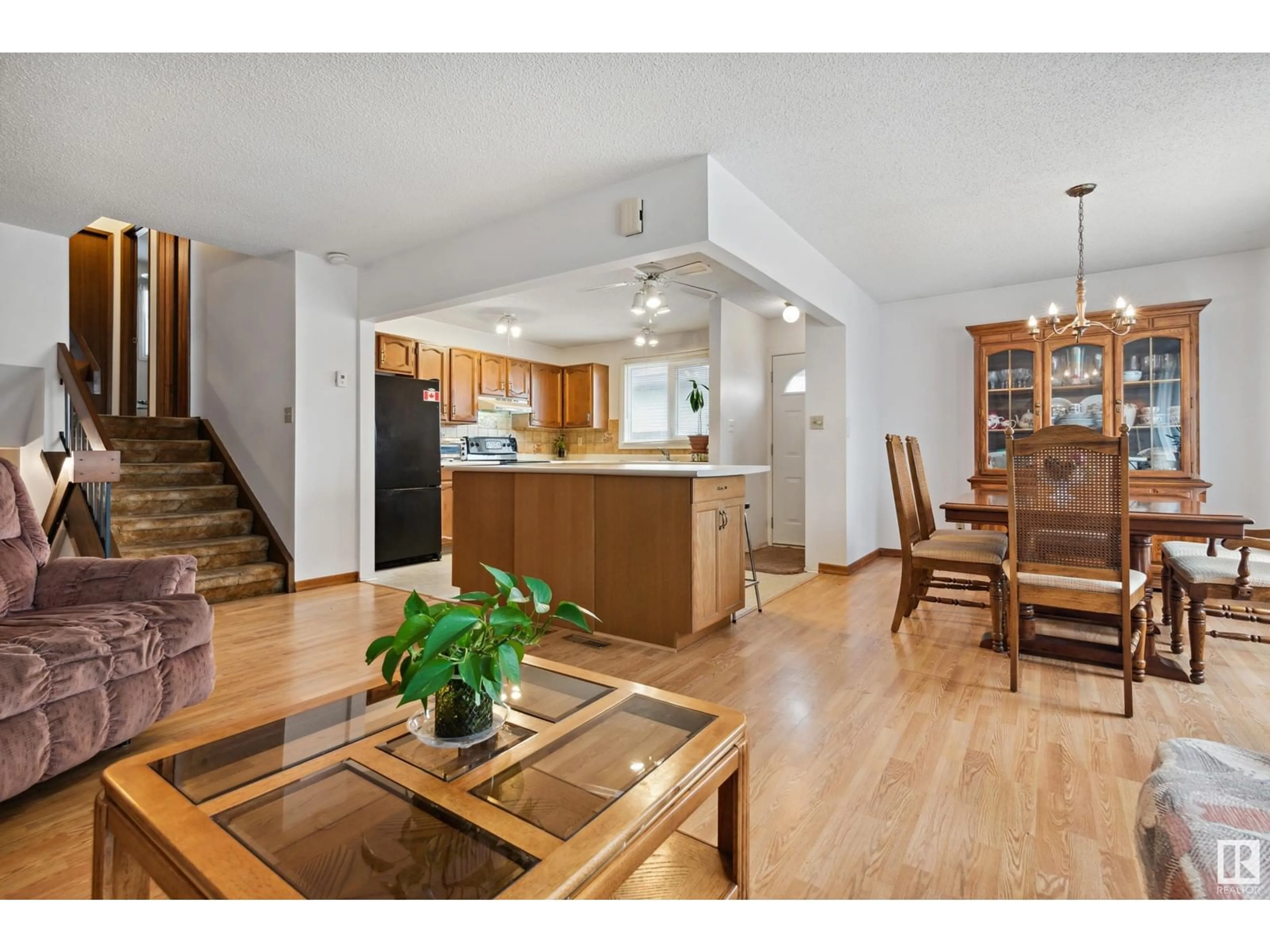 Open concept kitchen, wood/laminate floor for 9227 170 AV, Edmonton Alberta T5Z1C9
