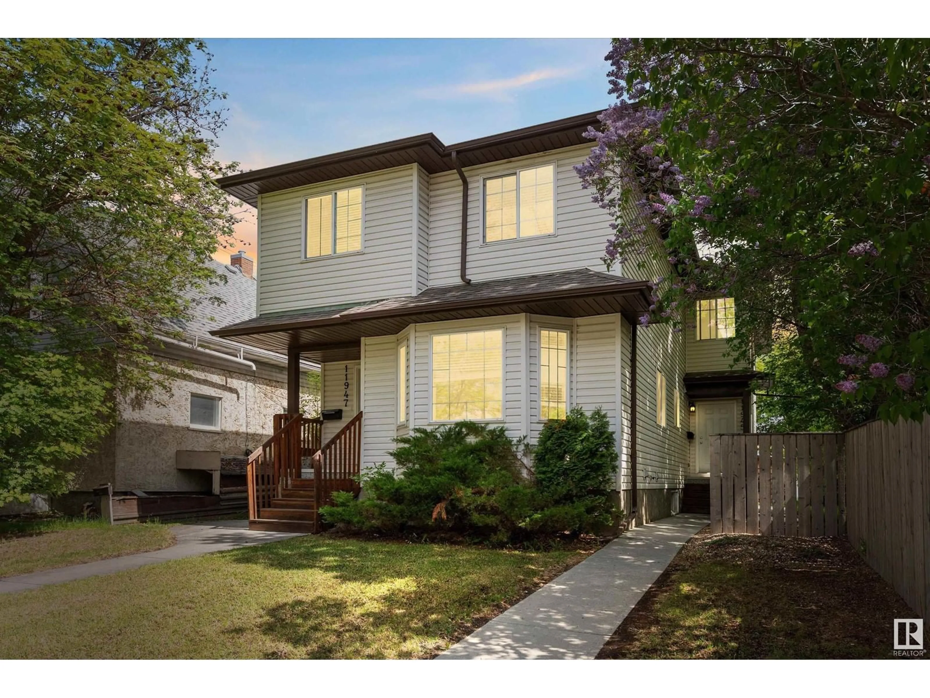 Home with vinyl exterior material, street for NW - 11945/11947 80 ST, Edmonton Alberta T5B2N8