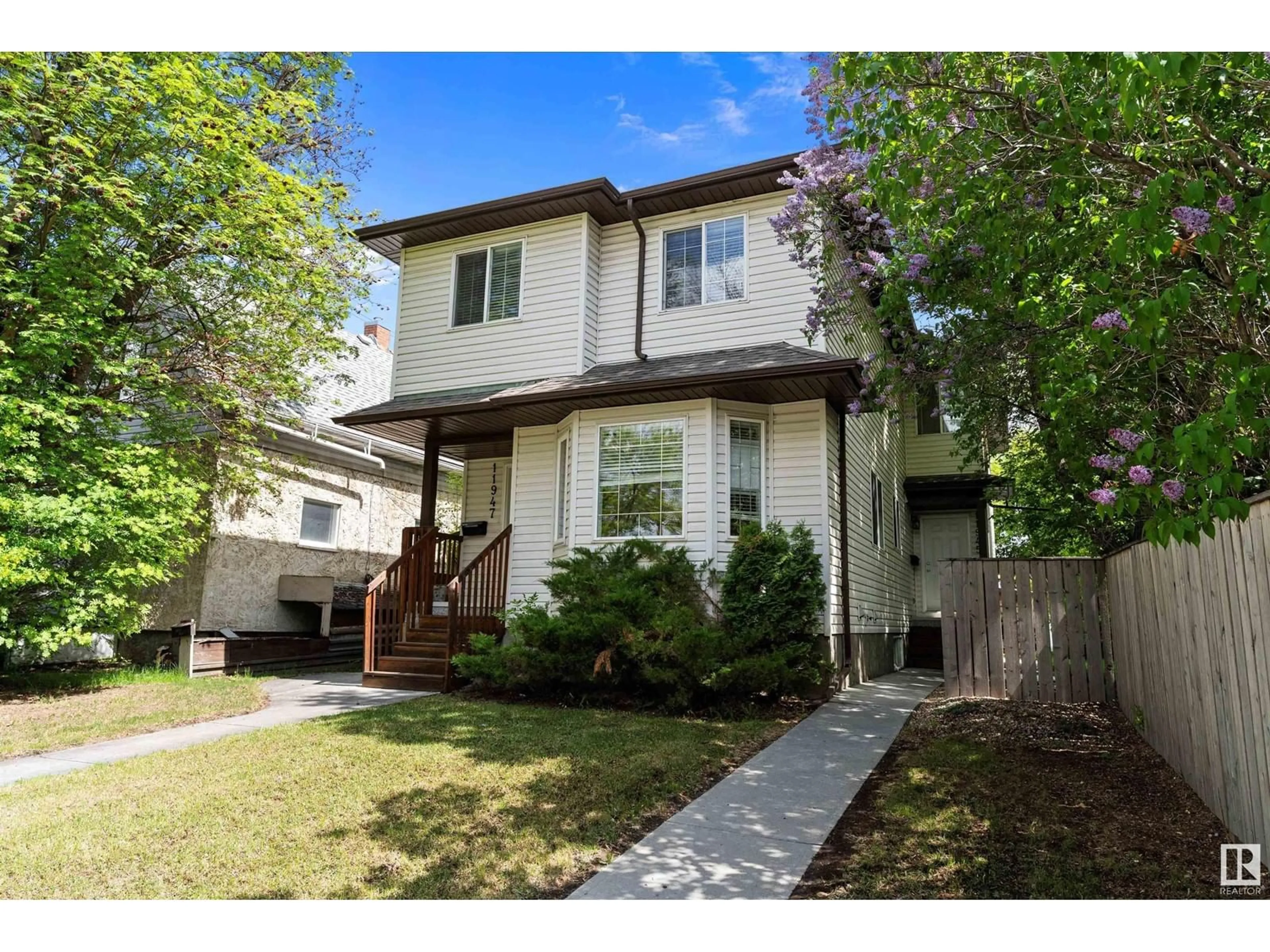 Home with vinyl exterior material, street for NW - 11945/11947 80 ST, Edmonton Alberta T5B2N8