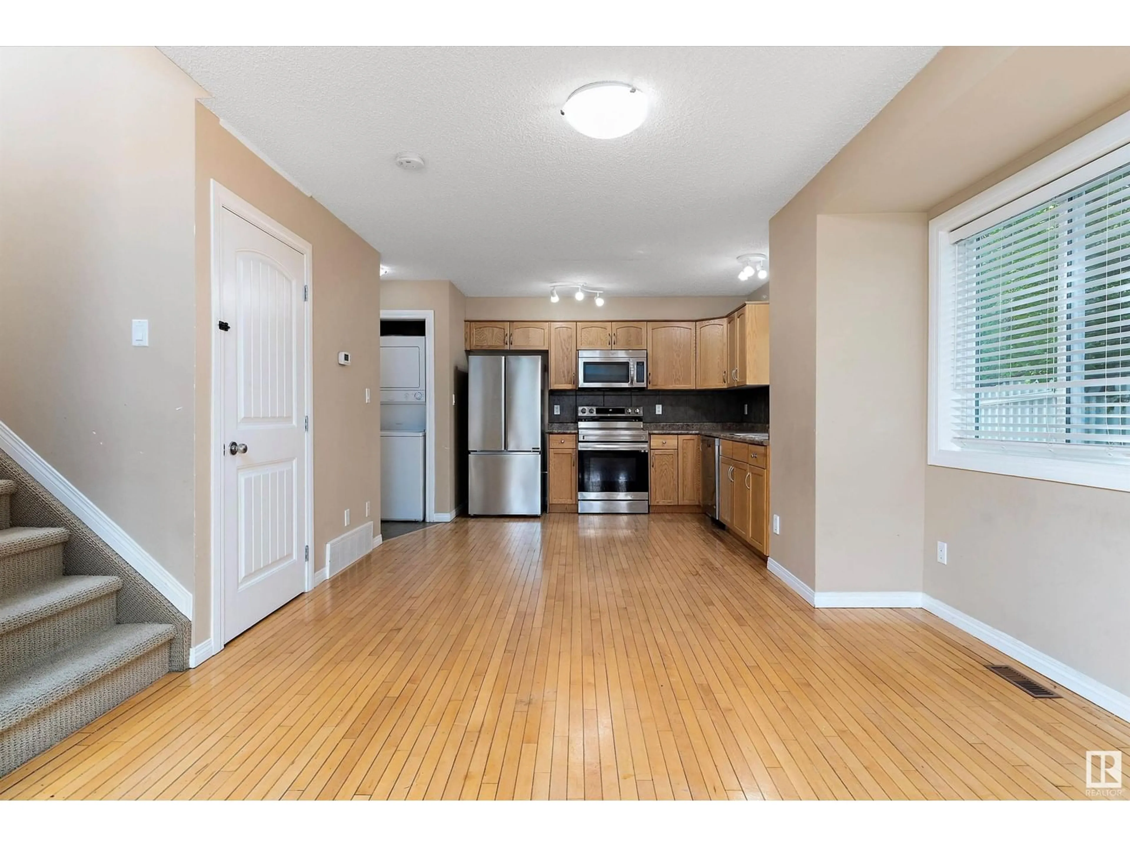 Open concept kitchen, wood/laminate floor for NW - 11945/11947 80 ST, Edmonton Alberta T5B2N8