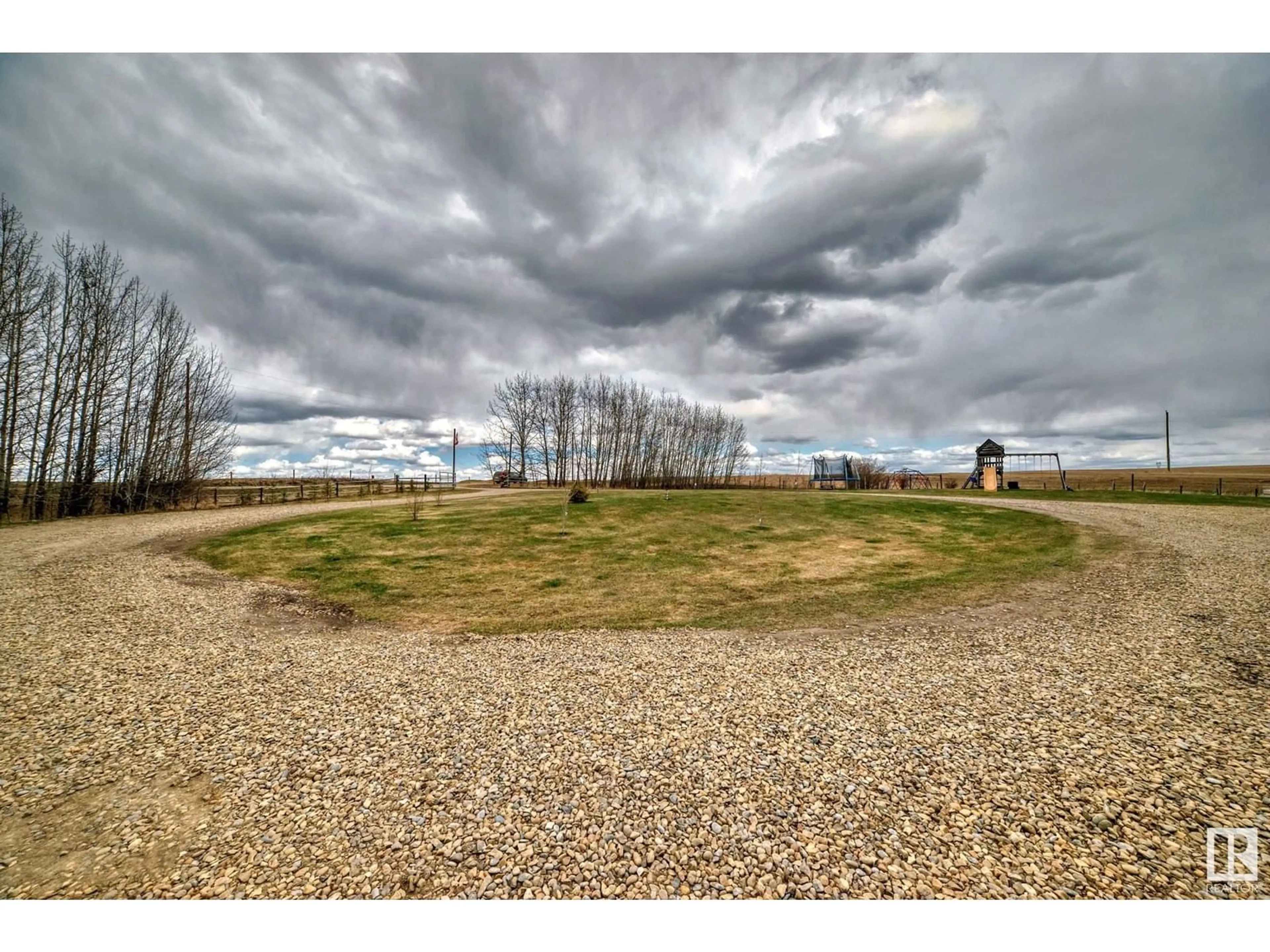 A pic from outside/outdoor area/front of a property/back of a property/a pic from drone, water/lake/river/ocean view for 25113 TWP RD 272, Rural Rockyview County Alberta T4B2A3