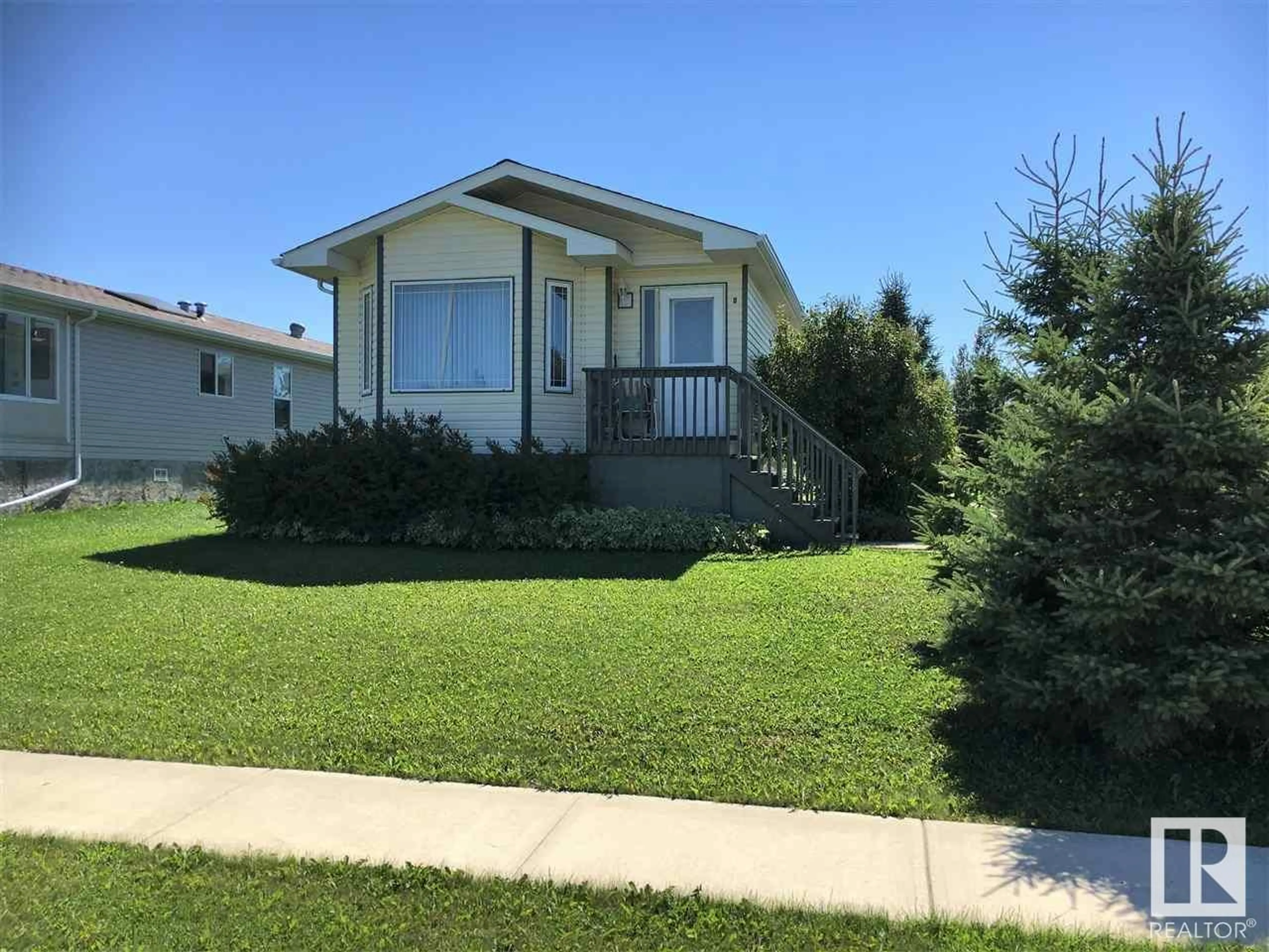Home with vinyl exterior material, street for 8 WOODCROFT PL, Warburg Alberta T0C2T0